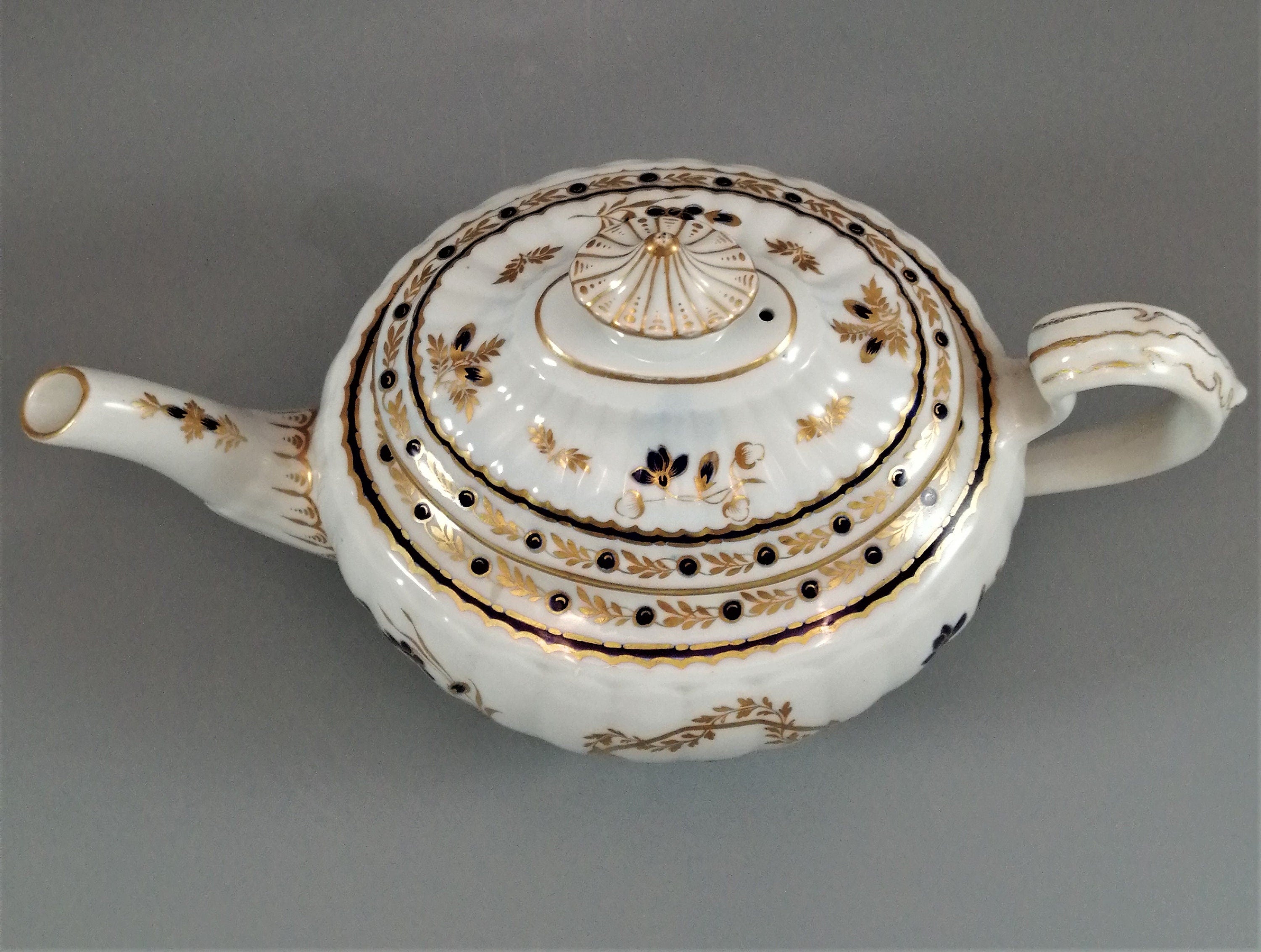 Flight & Barr Worcester barrel-shaped teapot and stand, gold and blue floral design, incised 'M' mark, antique English porcelain, c. 1792