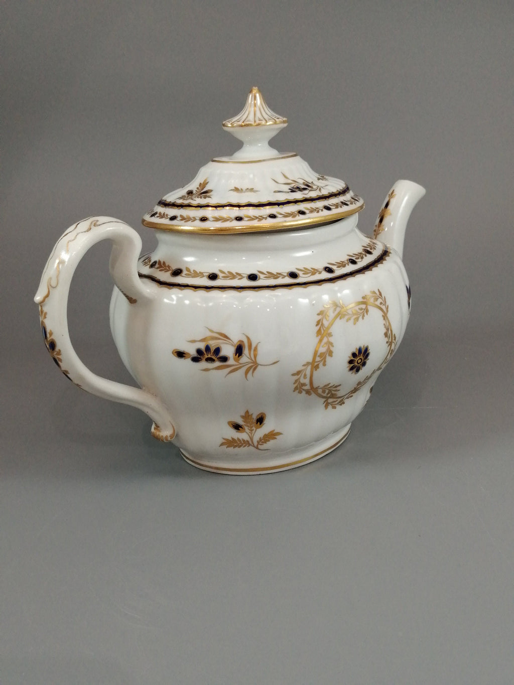 Flight & Barr Worcester barrel-shaped teapot and stand, gold and blue floral design, incised 'M' mark, antique English porcelain, c. 1792