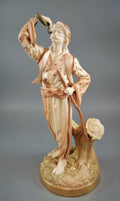 A rare Royal Worcester figurine titled "The Snake Charmer," dated 1898.