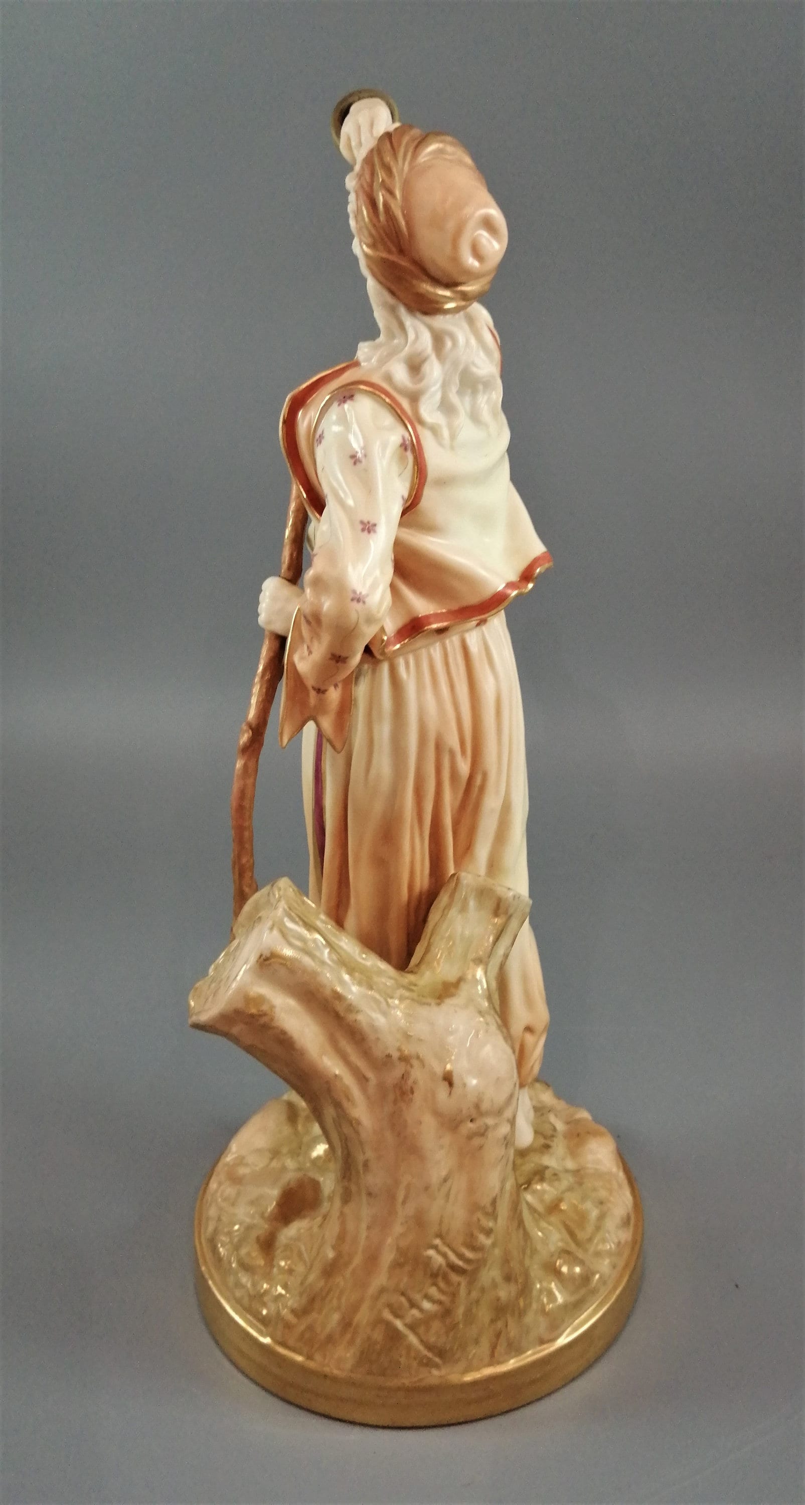 A rare Royal Worcester figurine titled "The Snake Charmer," dated 1898.