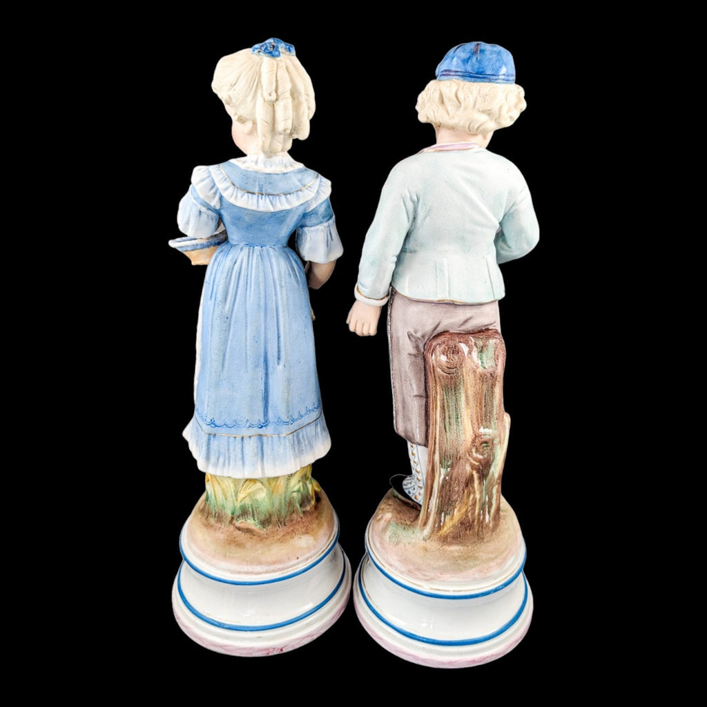 Pair of large antique 19th century French bisque porcelain figurines