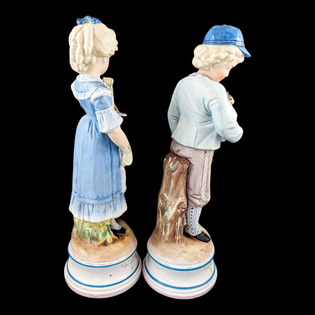 Pair of large antique 19th century French bisque porcelain figurines