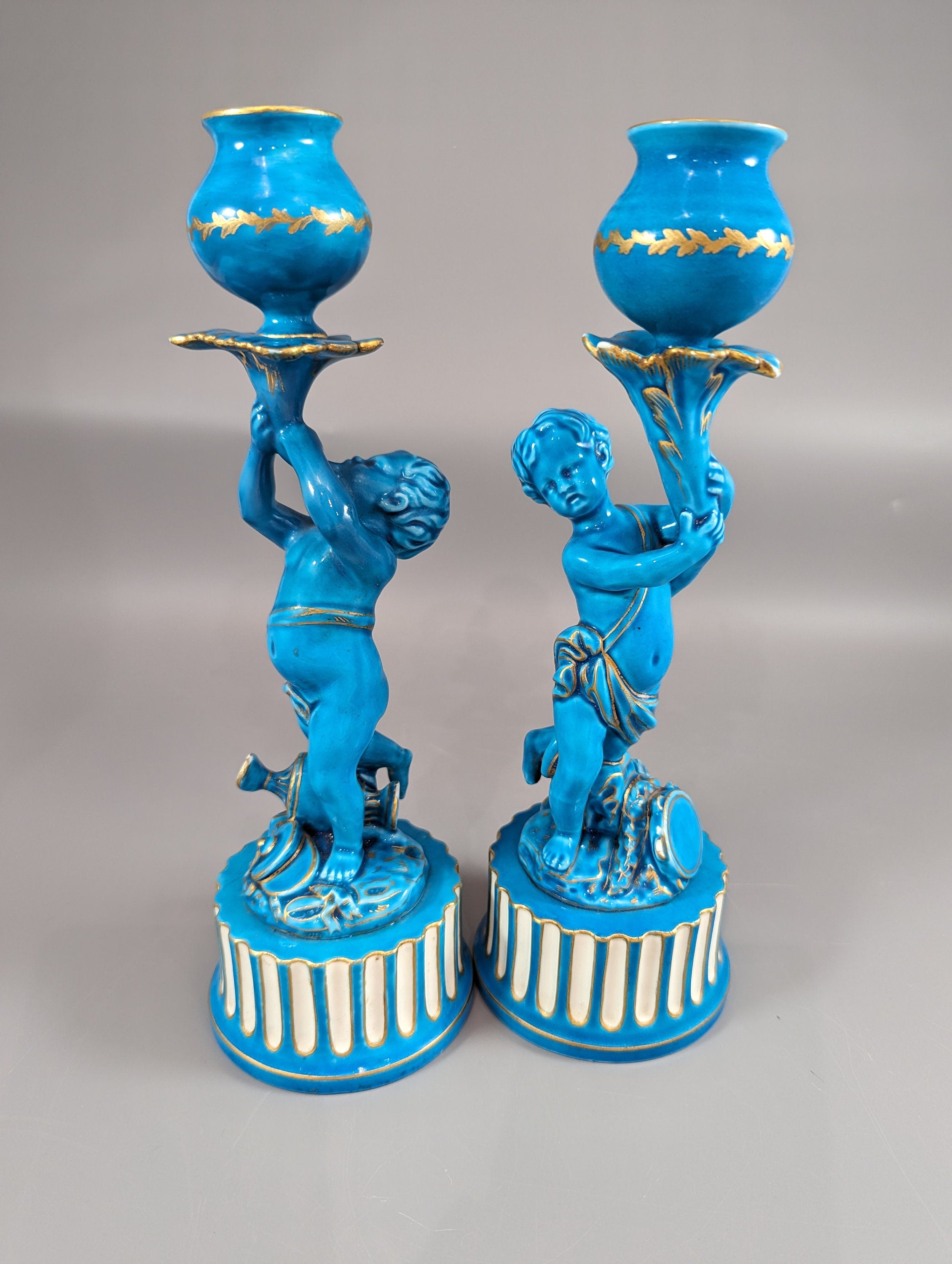 A two Minton style Cherub  candlesticks,c.1850