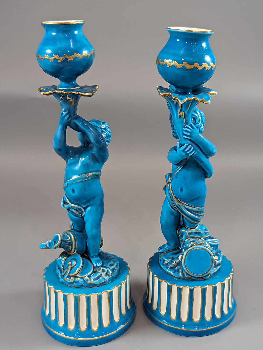 A two Minton style Cherub  candlesticks,c.1850