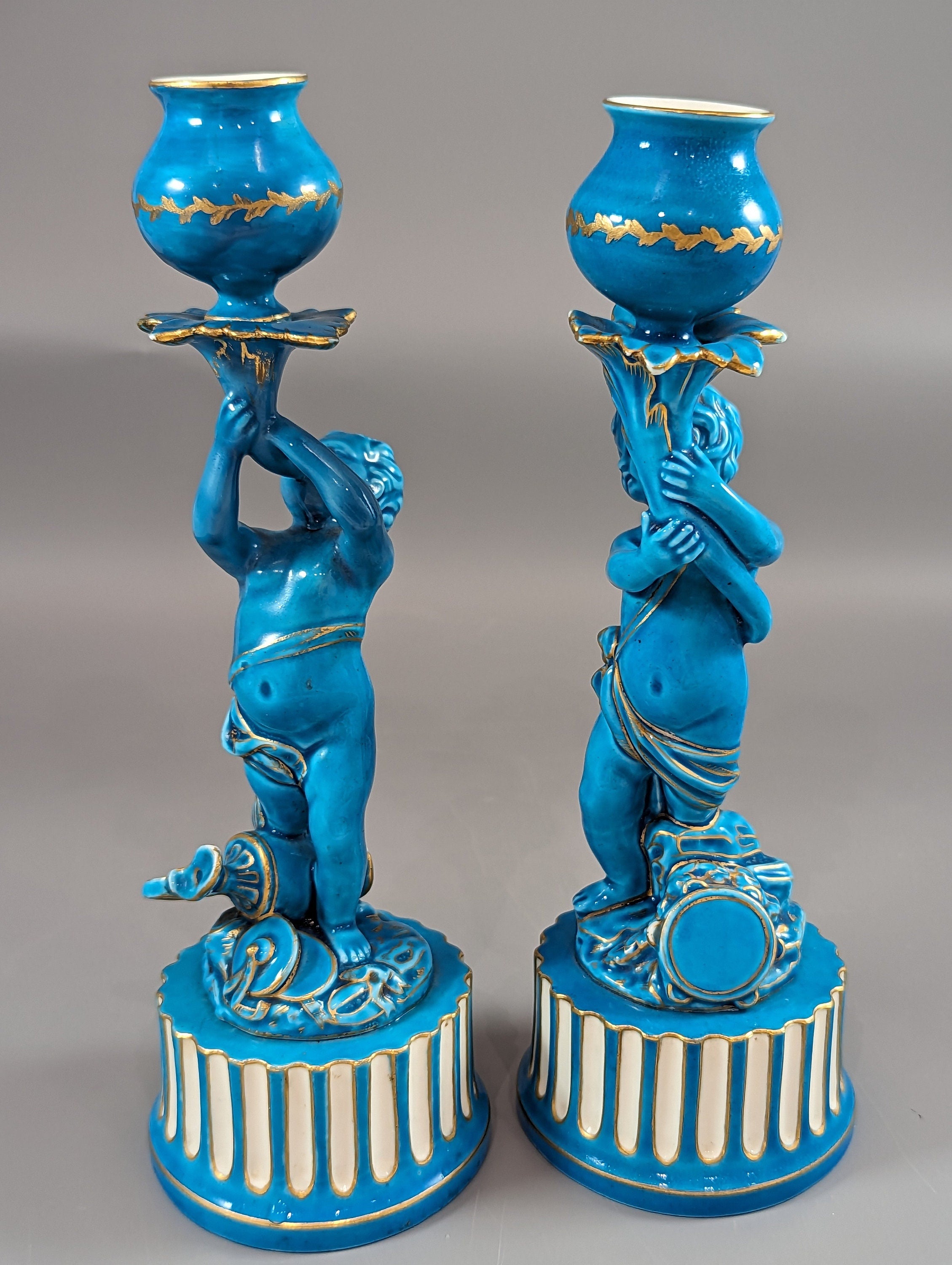 A two Minton style Cherub  candlesticks,c.1850