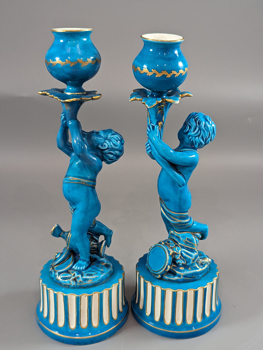 A two Minton style Cherub  candlesticks,c.1850