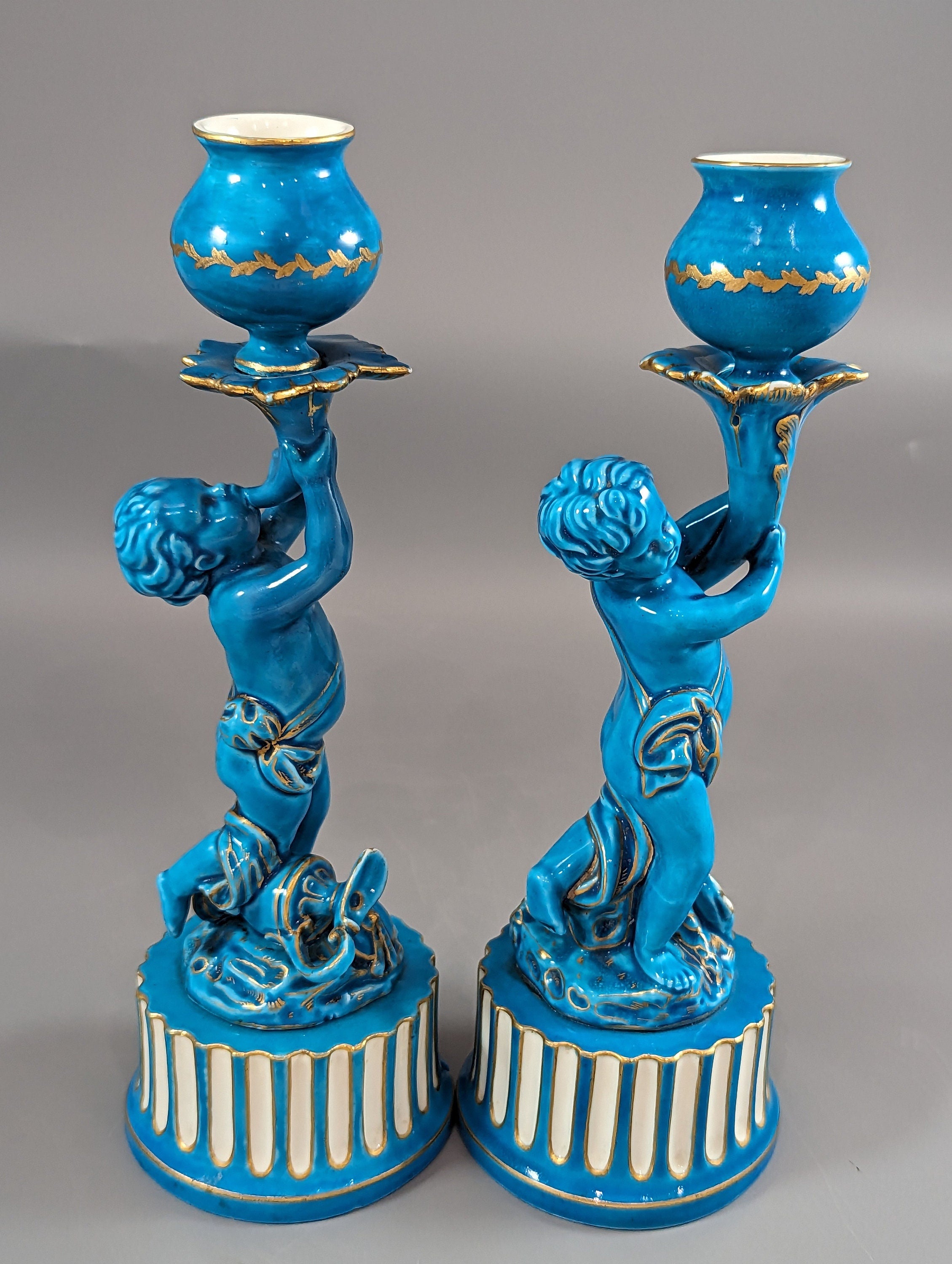 A two Minton style Cherub  candlesticks,c.1850