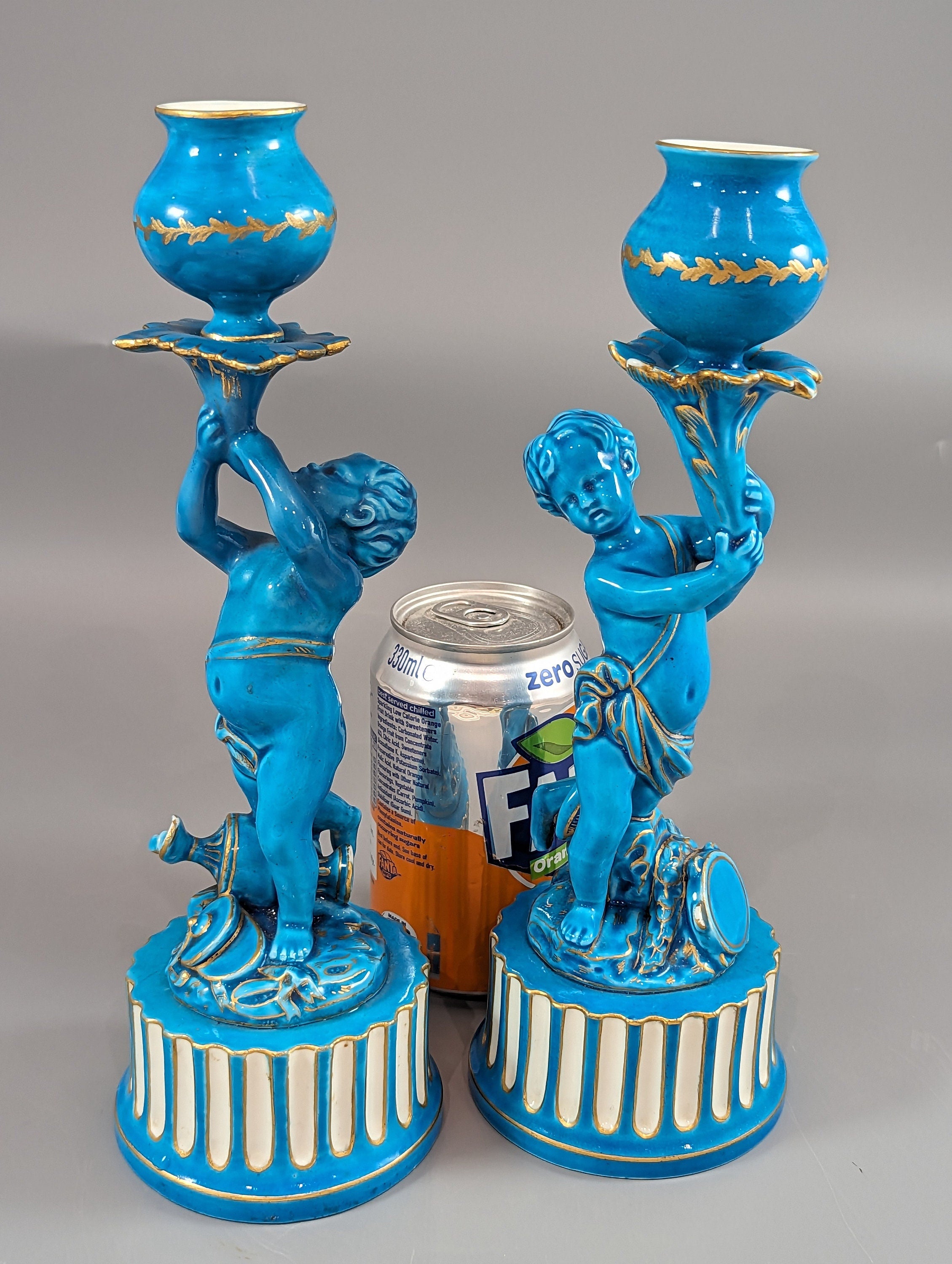 A two Minton style Cherub  candlesticks,c.1850