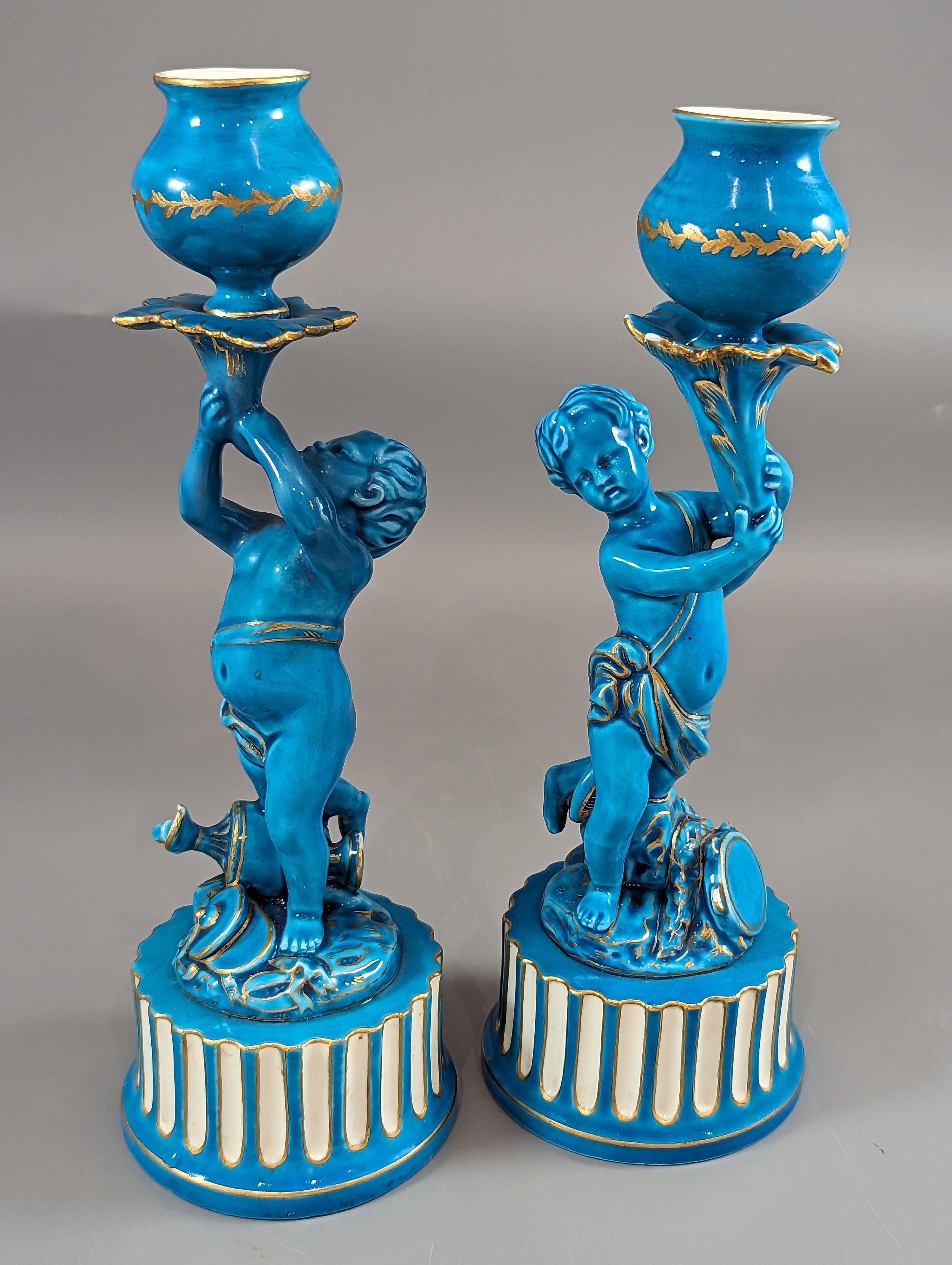 A two Minton style Cherub  candlesticks,c.1850