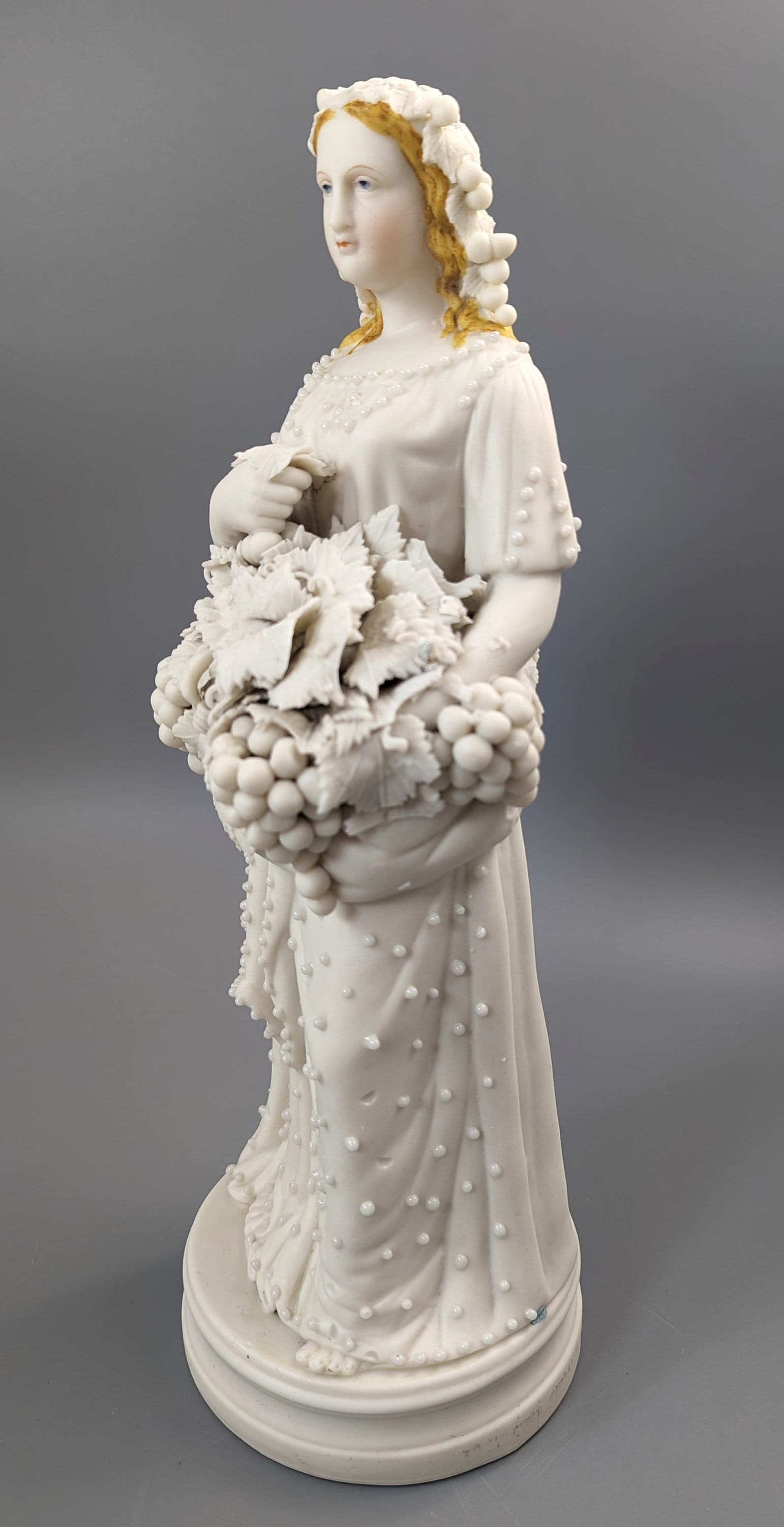 Lady With A Basket Of Grapes, parian ware porcelain, mid-19th century
