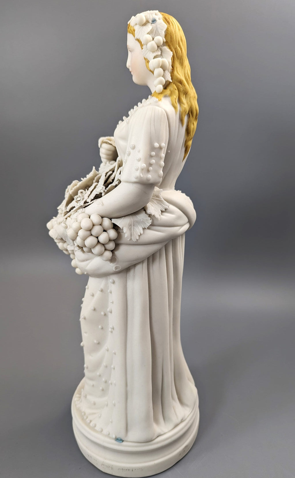 Lady With A Basket Of Grapes, parian ware porcelain, mid-19th century