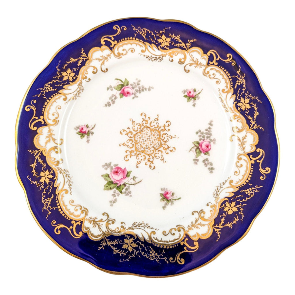 Antique hand painted Coalport plate with floral and gilt decoration.