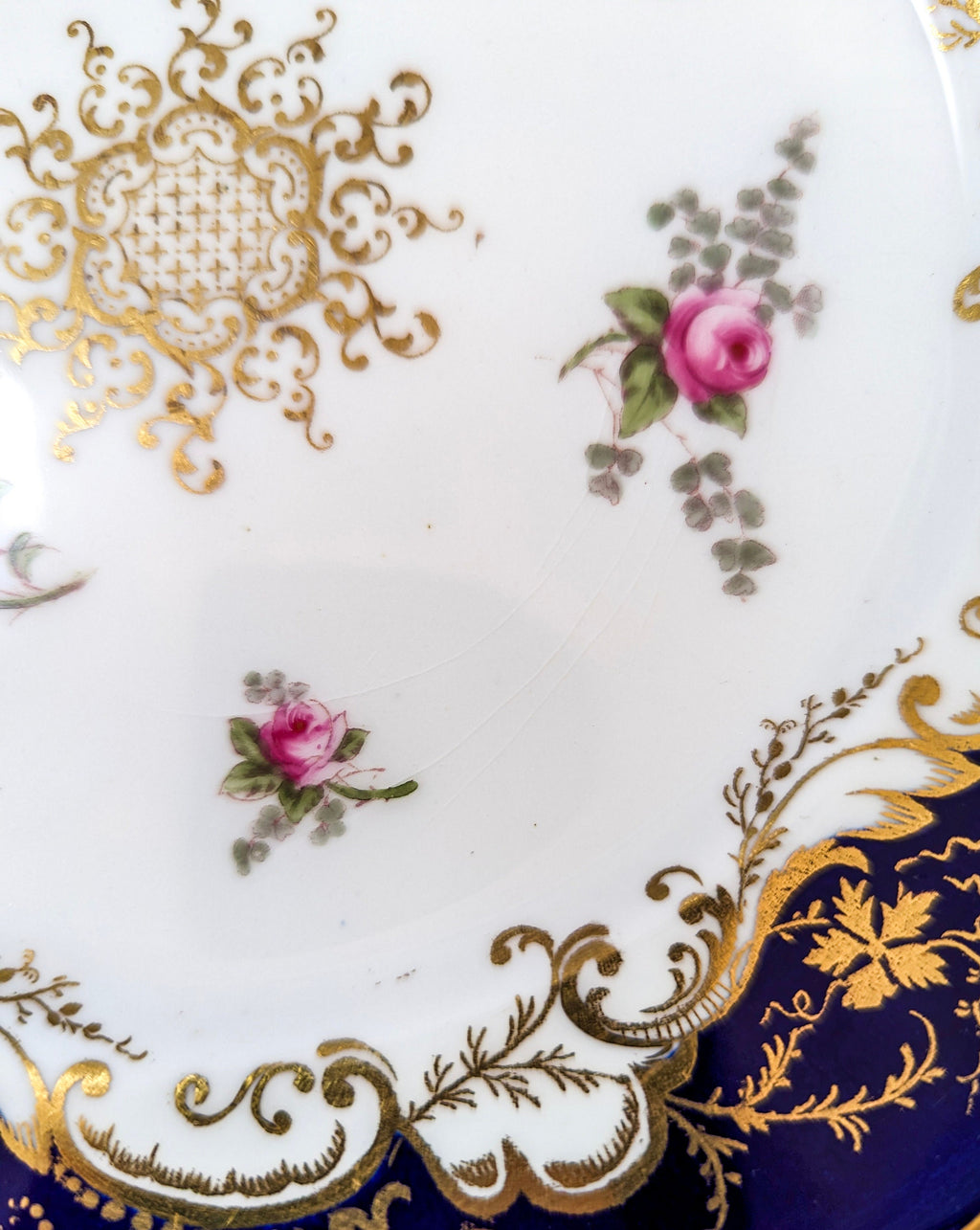 Antique hand painted Coalport plate with floral and gilt decoration.