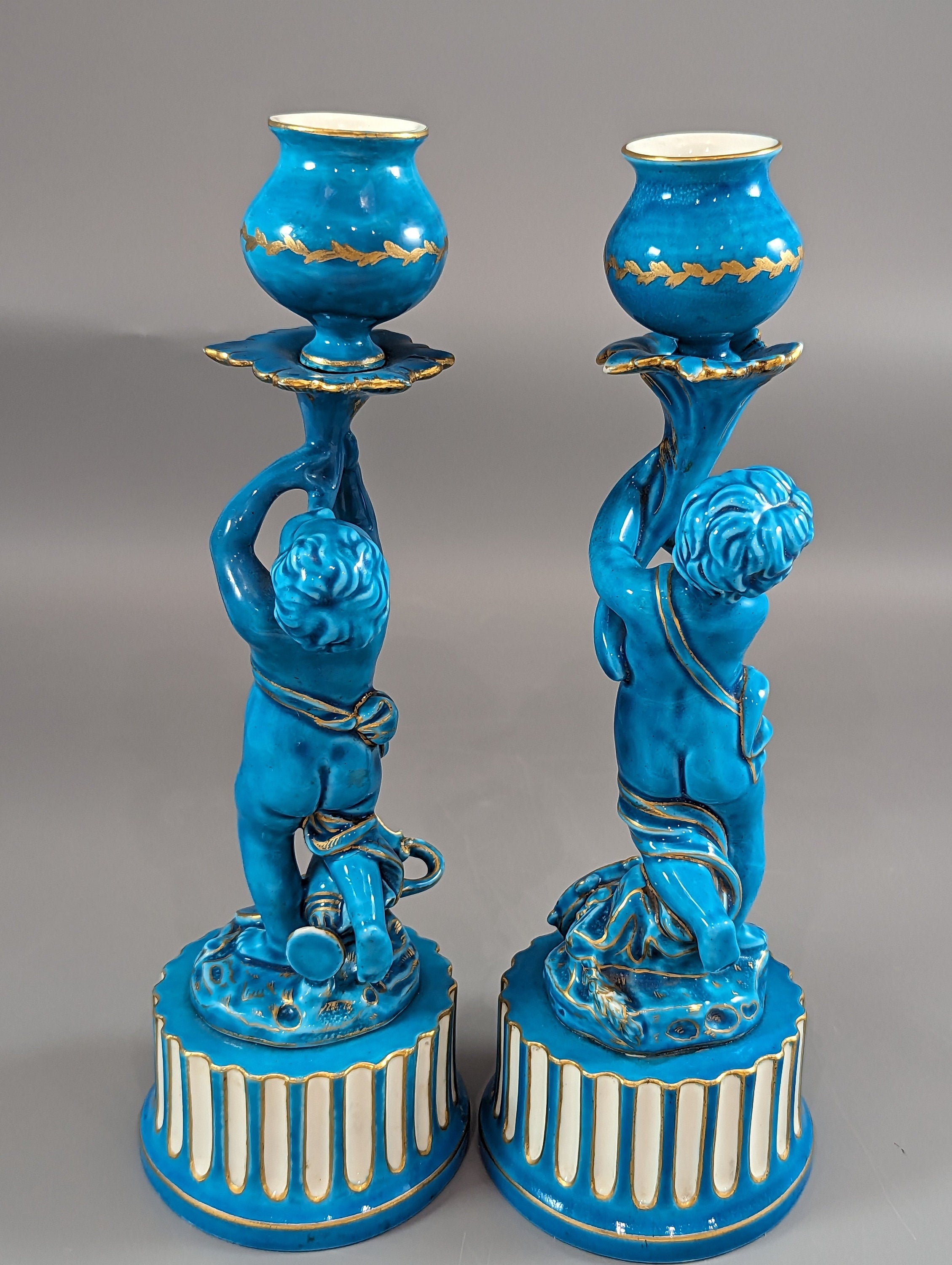 A two Minton style Cherub  candlesticks,c.1850