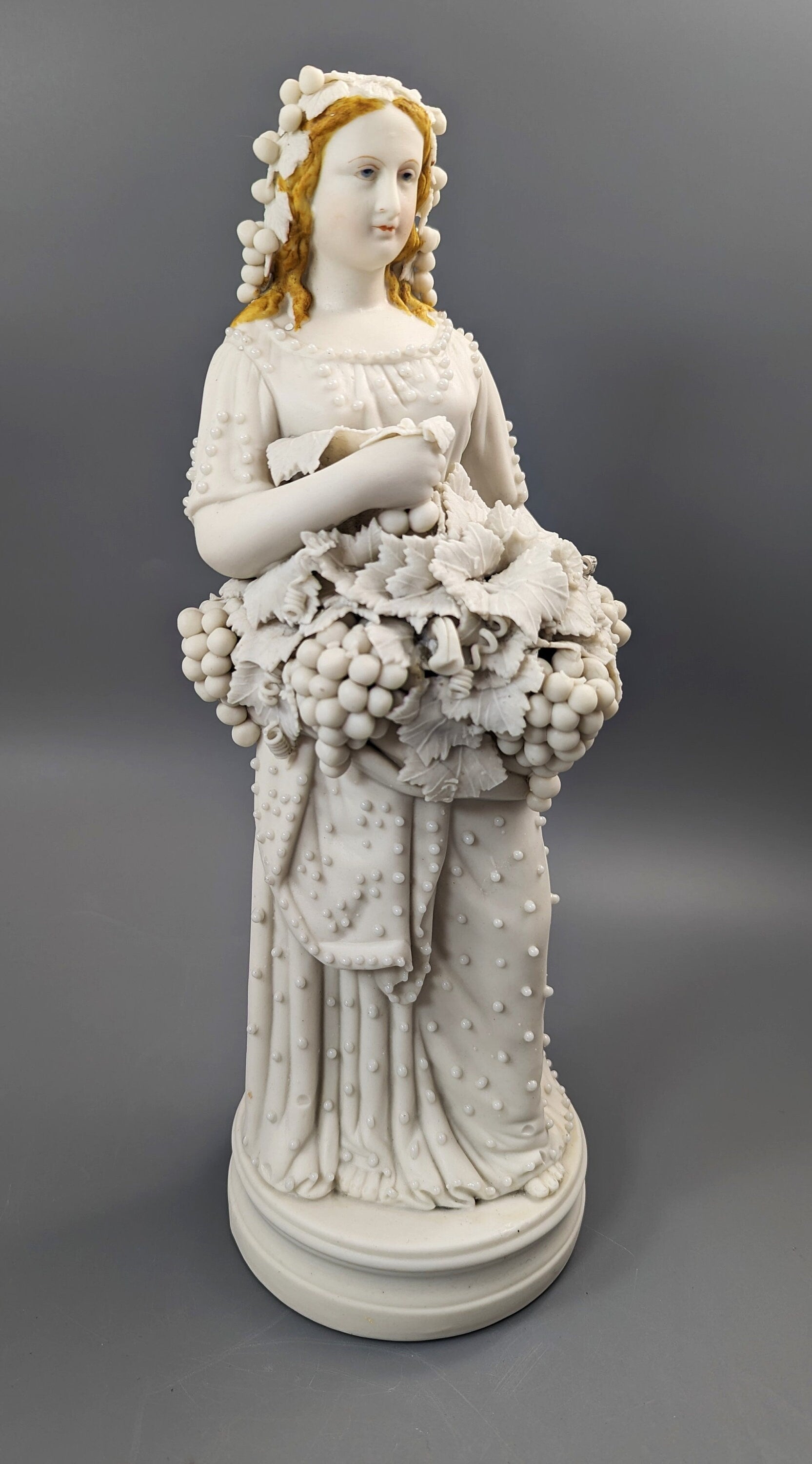 Lady With A Basket Of Grapes, parian ware porcelain, mid-19th century