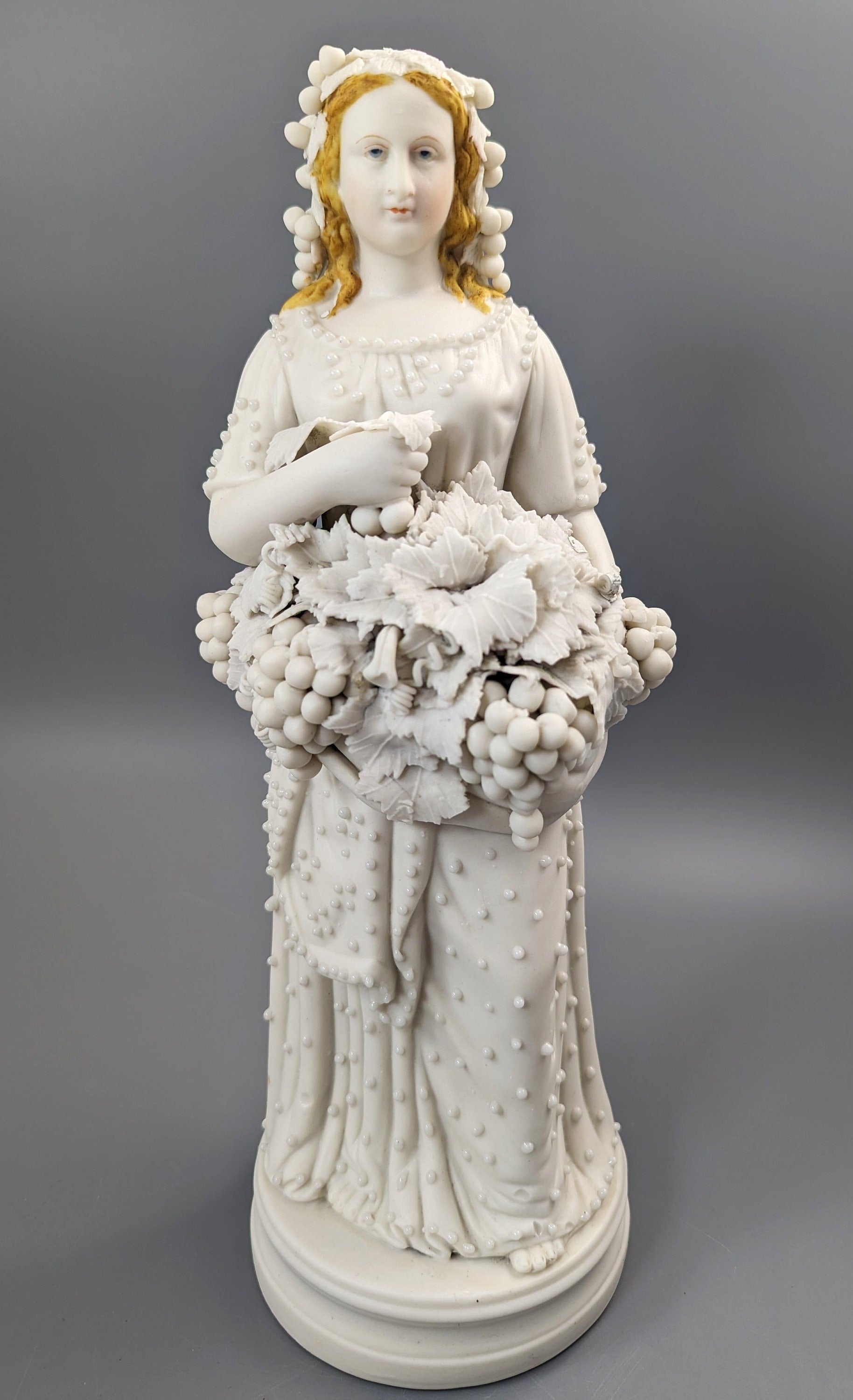 Lady With A Basket Of Grapes, parian ware porcelain, mid-19th century
