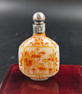 Antique enameled white glass snuff bottle with Guyue Xuan mark