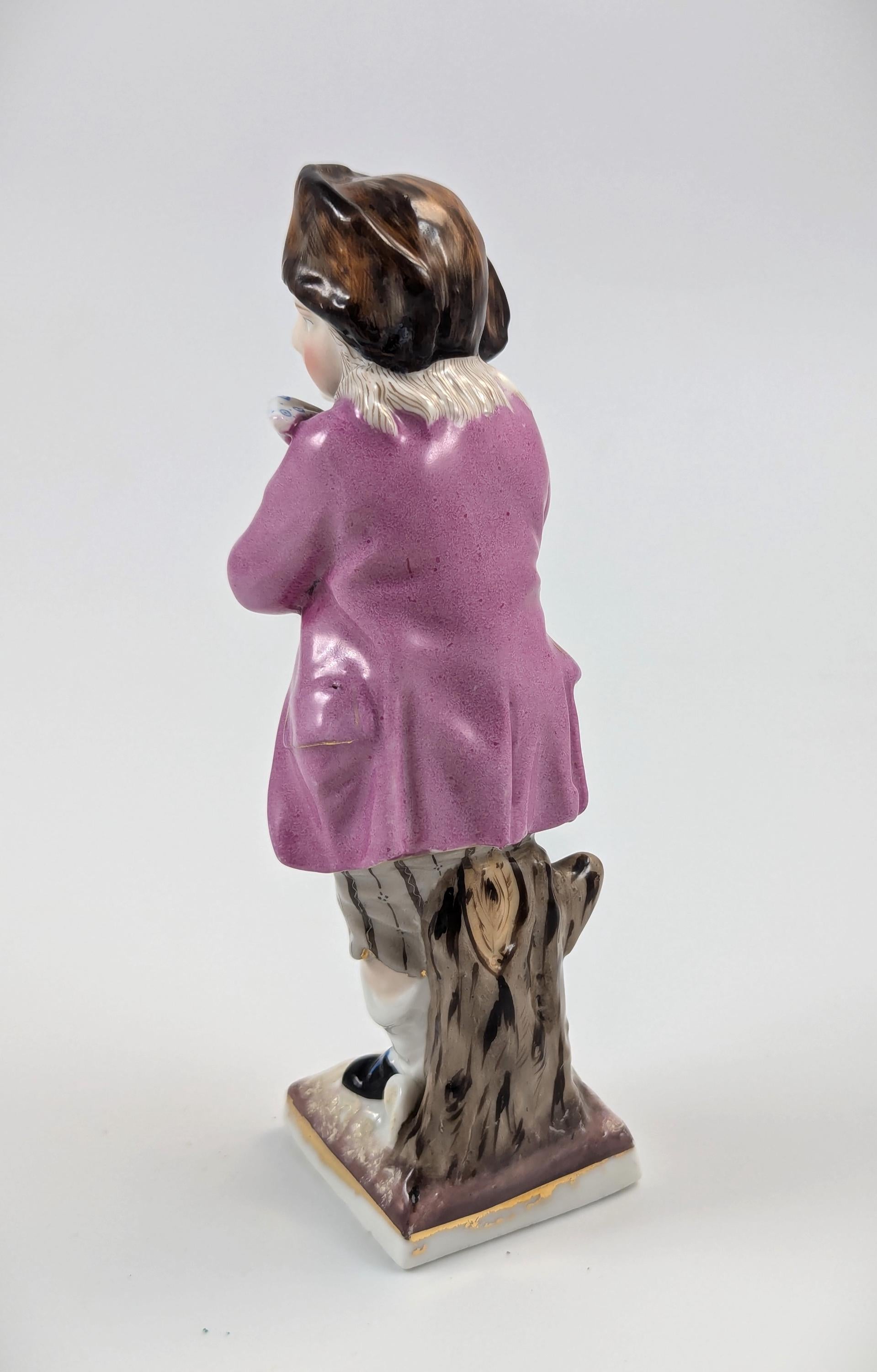 Sitzendorf antique porcelain "Skater" figurine hand-painted on gilt base, Germany, c. 1880s