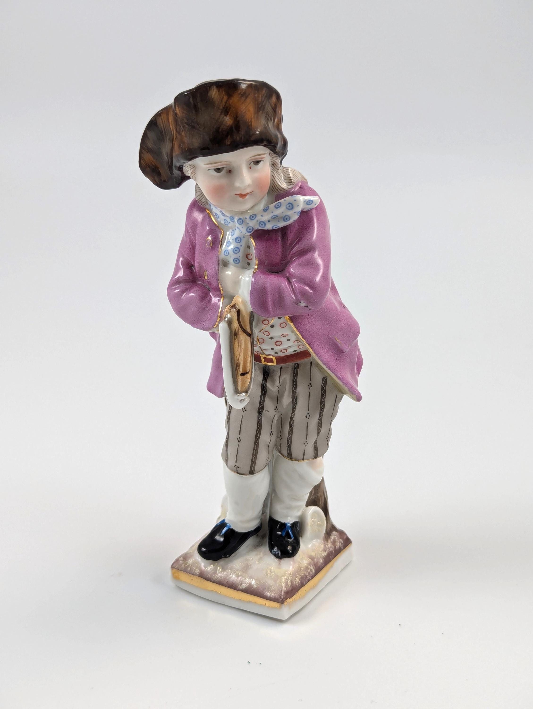 Sitzendorf antique porcelain "Skater" figurine hand-painted on gilt base, Germany, c. 1880s