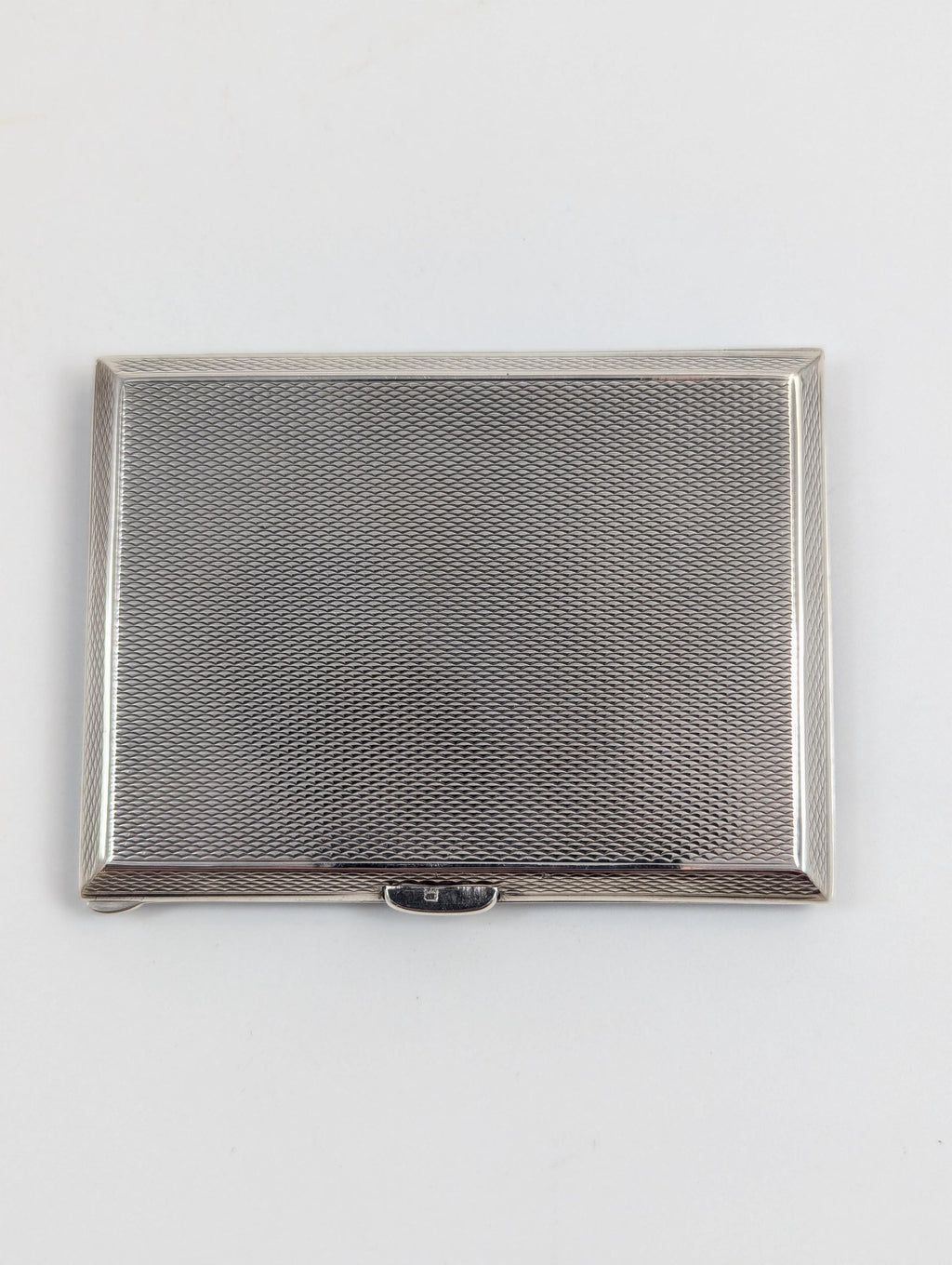 Art Deco sterling silver and black enamel cigarette case, marcasite front, engine-turned reverse, Goldsmiths & Silversmiths Co, 1932