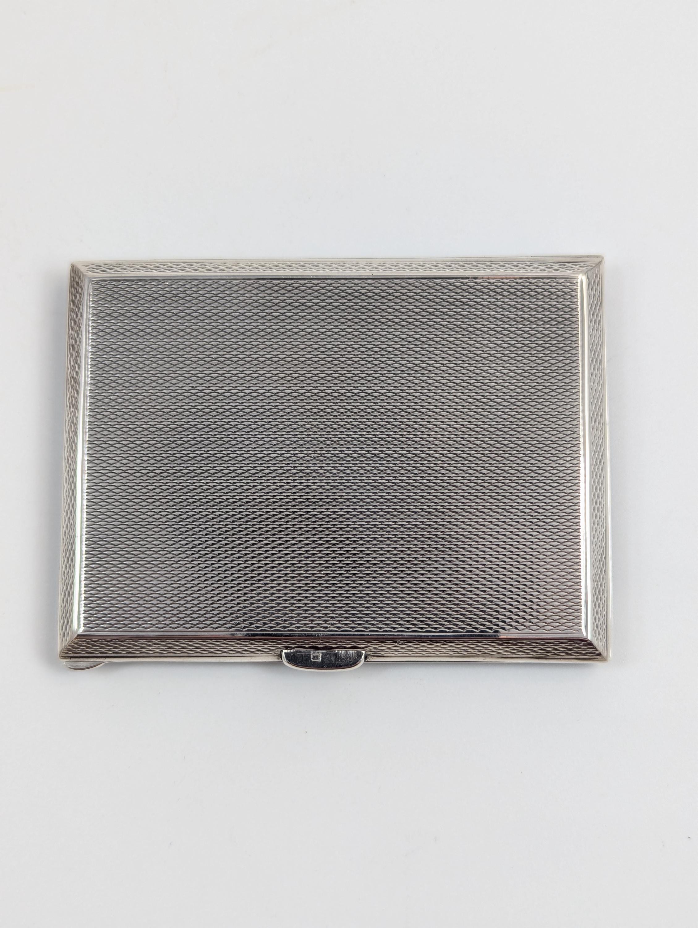 Art Deco sterling silver and black enamel cigarette case, marcasite front, engine-turned reverse, Goldsmiths & Silversmiths Co, 1932