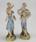 Ernst Bohne and Söhne Figurines: Boy and Girl Holding Children, c. 1887