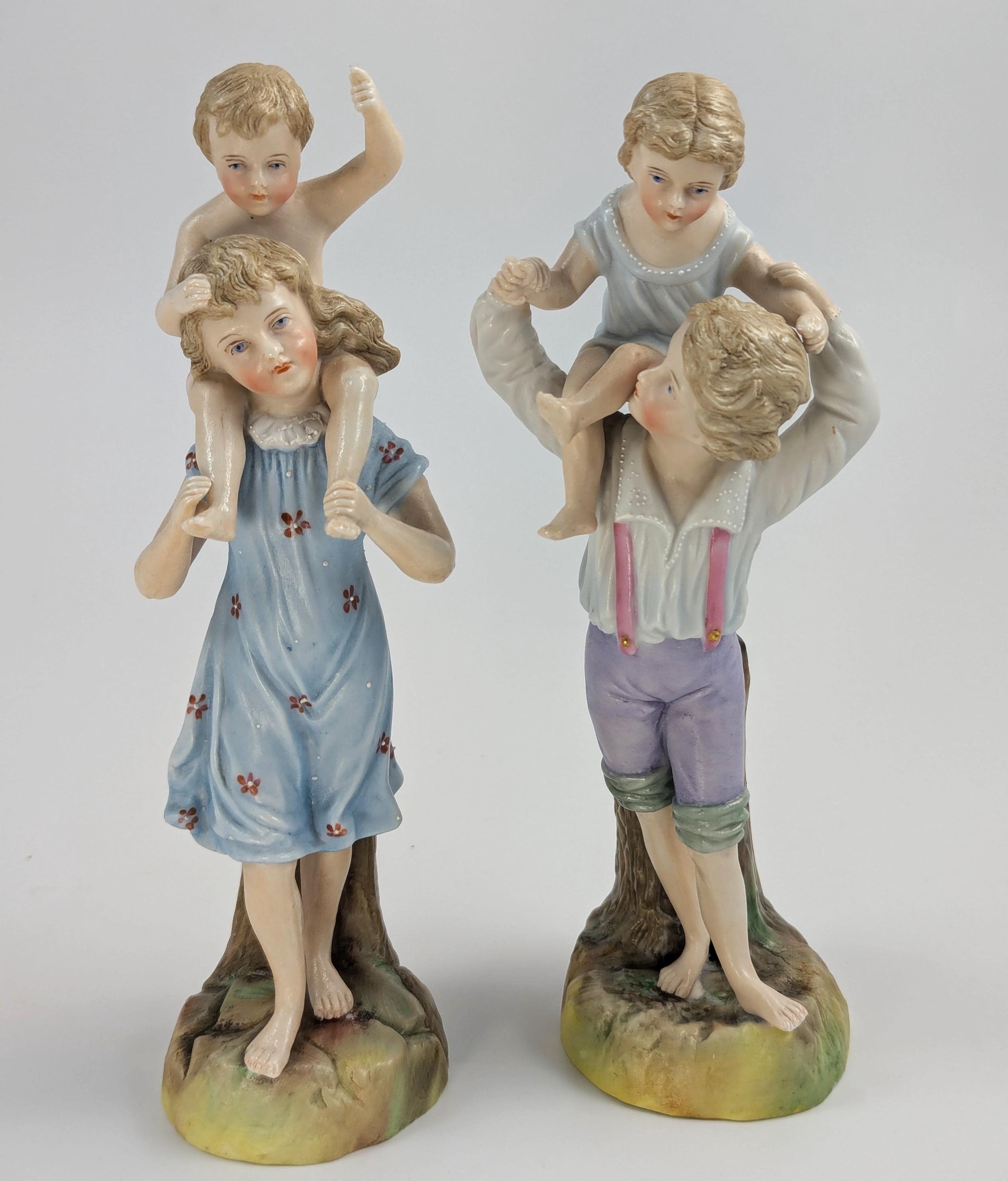 Ernst Bohne and Söhne Figurines: Boy and Girl Holding Children, c. 1887
