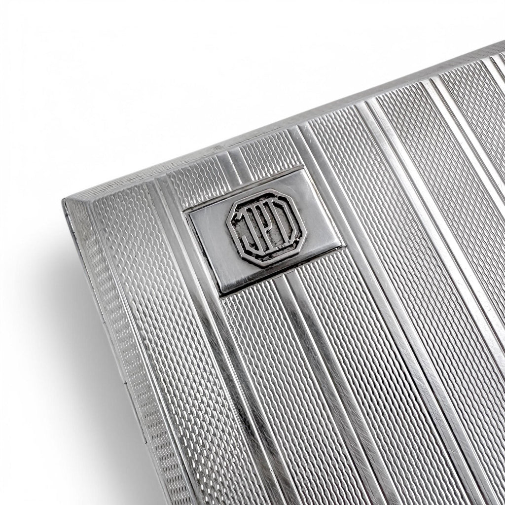 Large gilt sterling silver WWII cigarette case with engine-turned design, 130 g