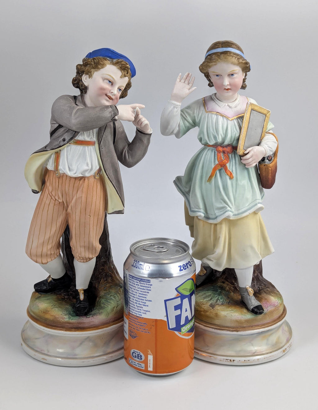A Pair of Bisque Porcelain Figurines, France, 19th century.