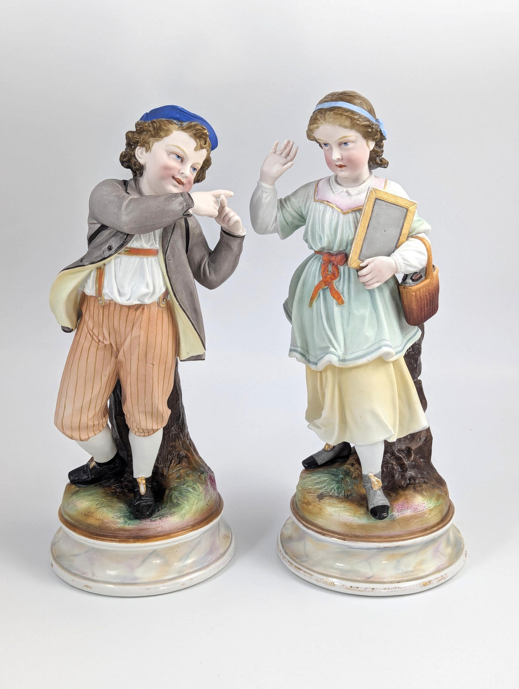 A Pair of Bisque Porcelain Figurines, France, 19th century.