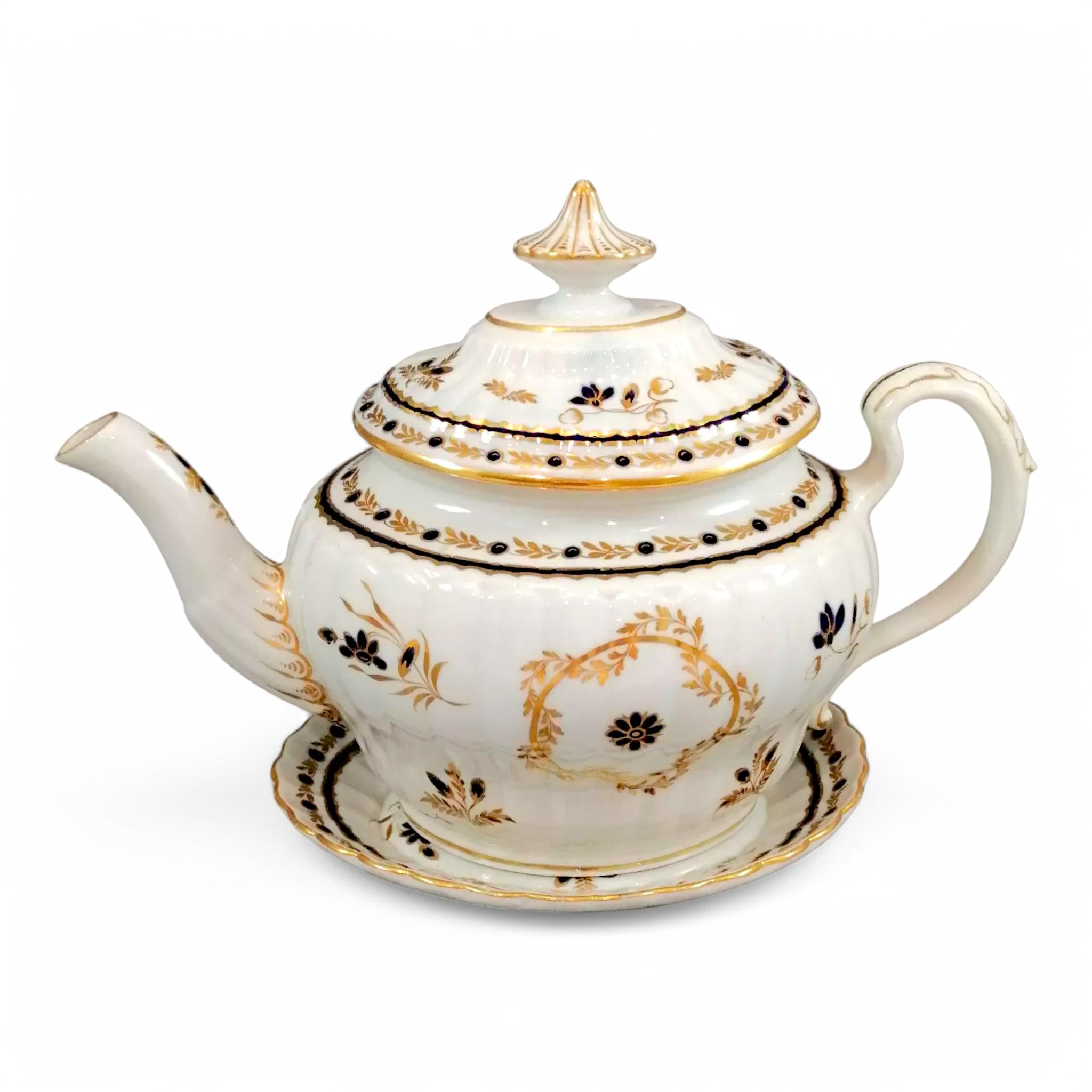 Flight & Barr Worcester barrel-shaped teapot and stand, gold and blue floral design, incised 'M' mark, antique English porcelain, c. 1792