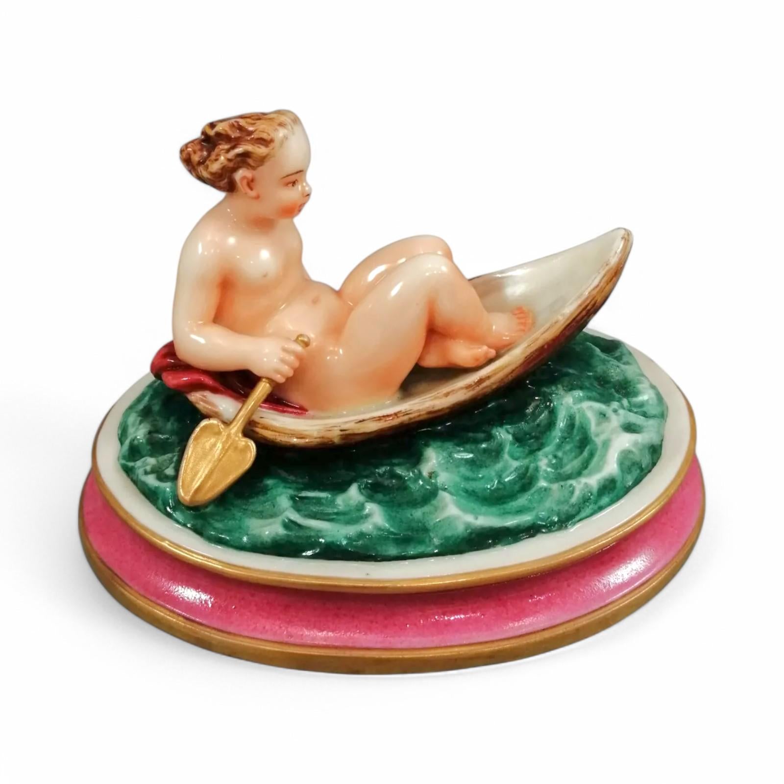 Antique majolica pottery figurine, nude girl in a boat, rare pink-base figure, Minton or French style, gilded oar, 12.8 cm