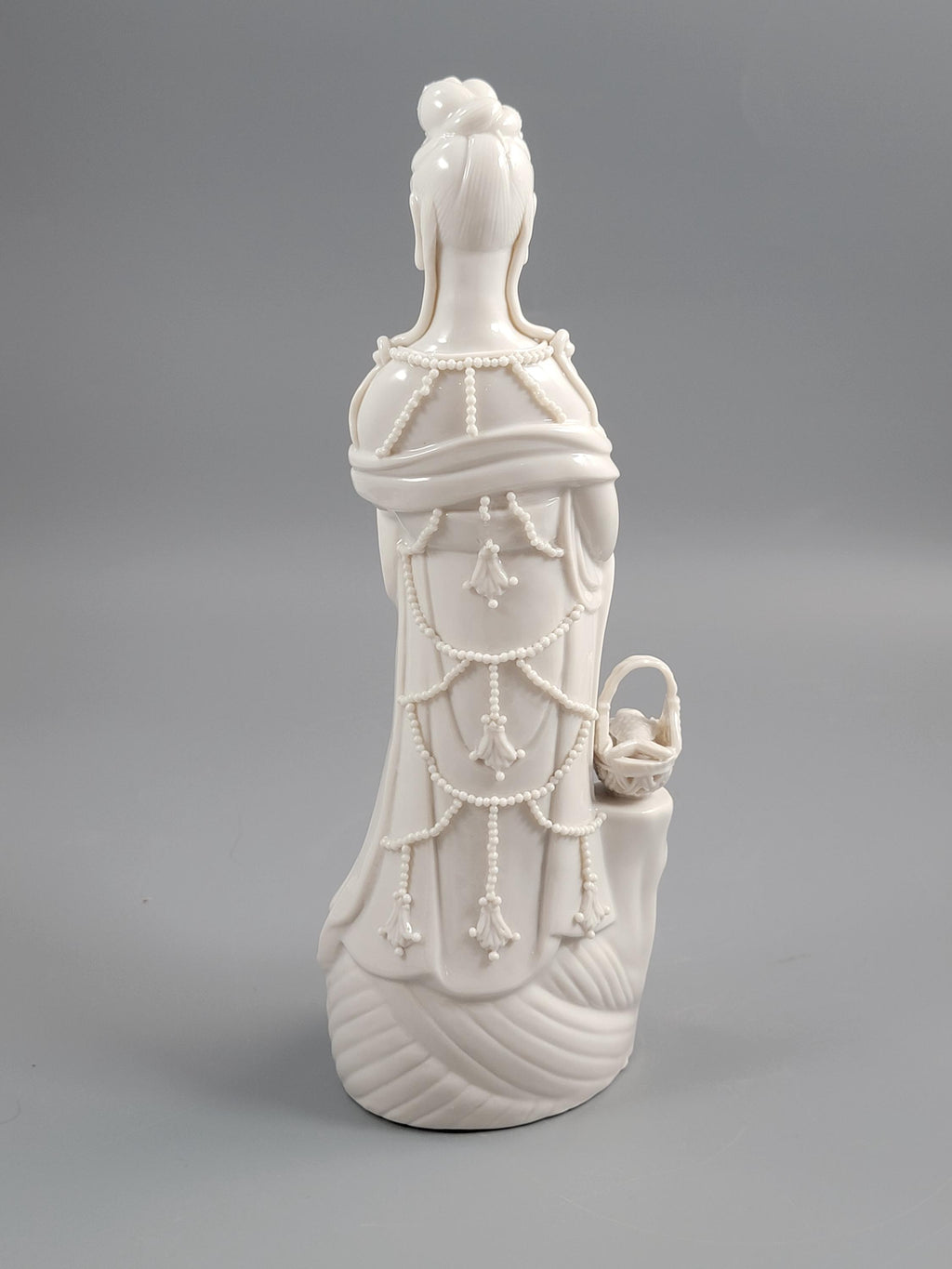 Dehua Blanc de Chine Guanyin with Fish Basket & Dragon Base, early 20th c