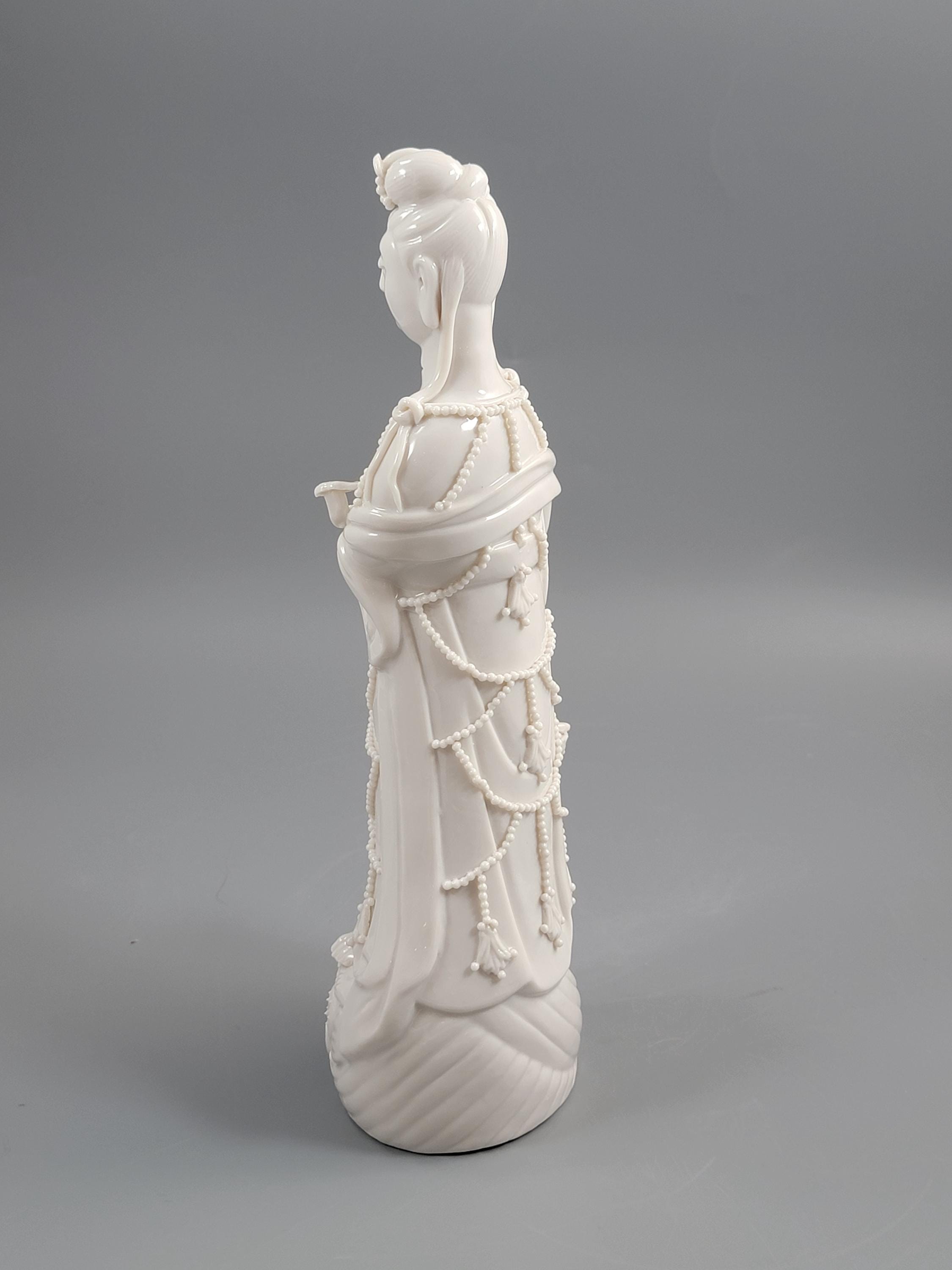 Dehua Blanc de Chine Guanyin with Fish Basket & Dragon Base, early 20th c