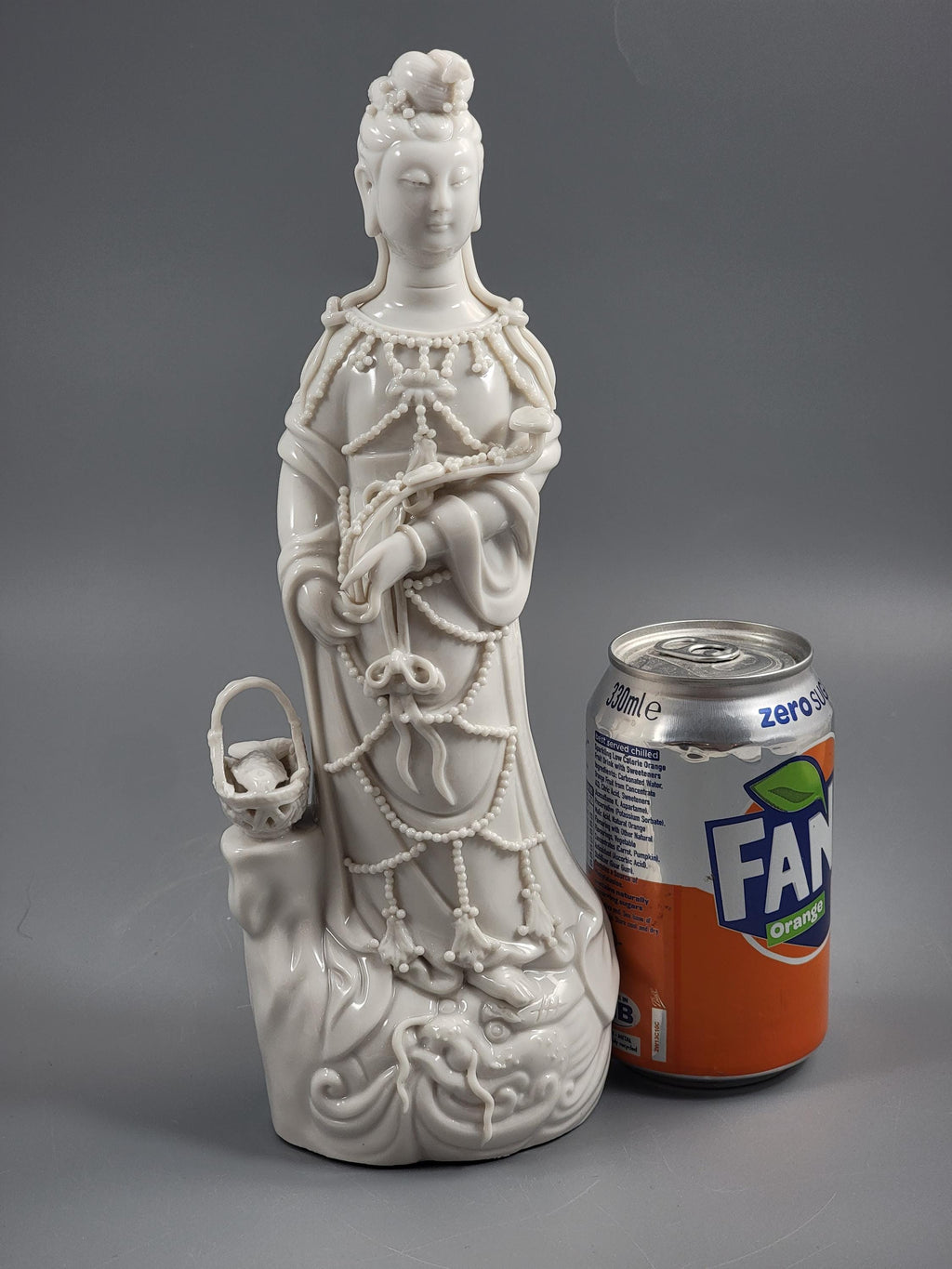 Dehua Blanc de Chine Guanyin with Fish Basket & Dragon Base, early 20th c