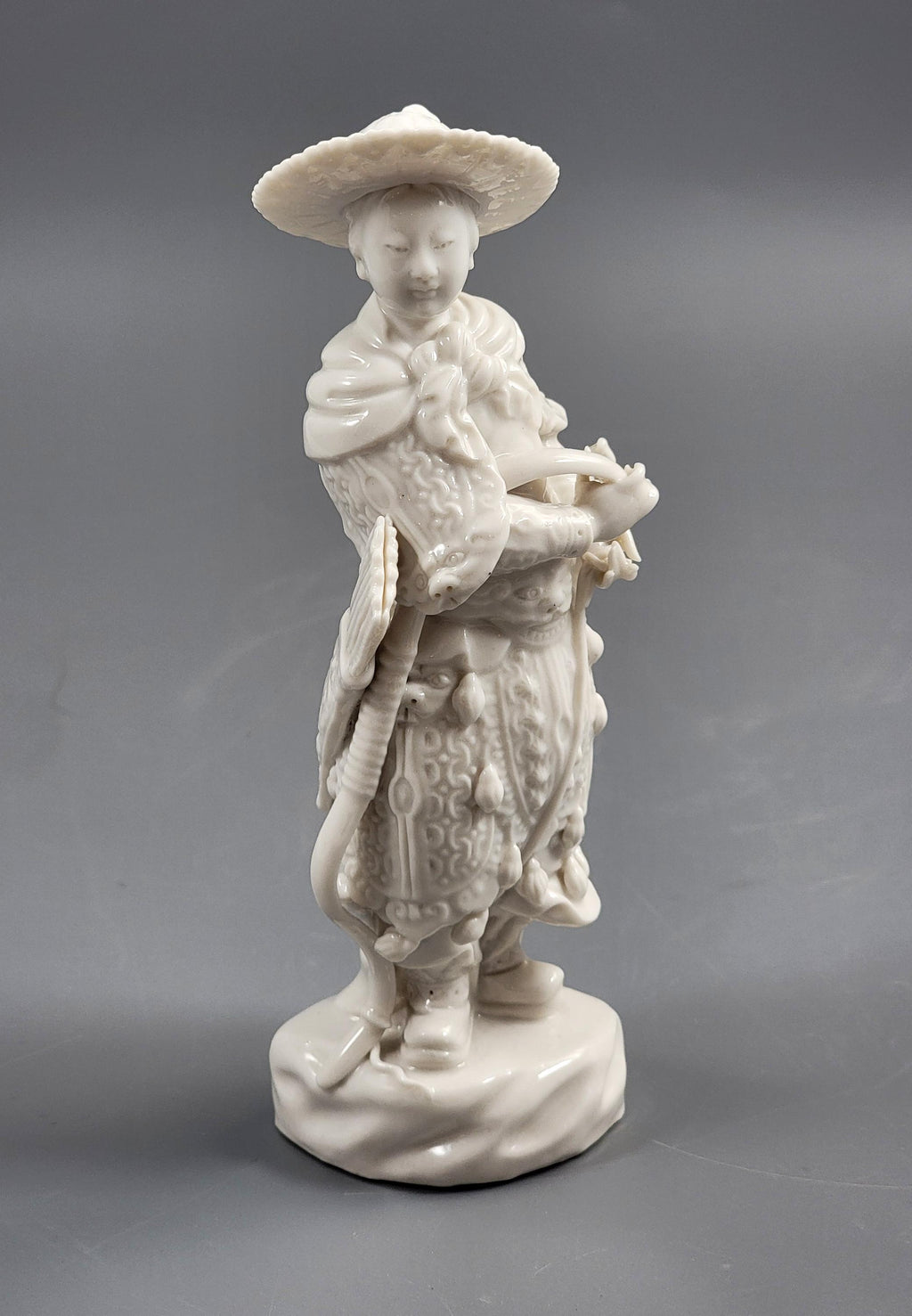 Dehua Blanc de Chine Huntress (Female Archer) on Rocky Base, c.1890