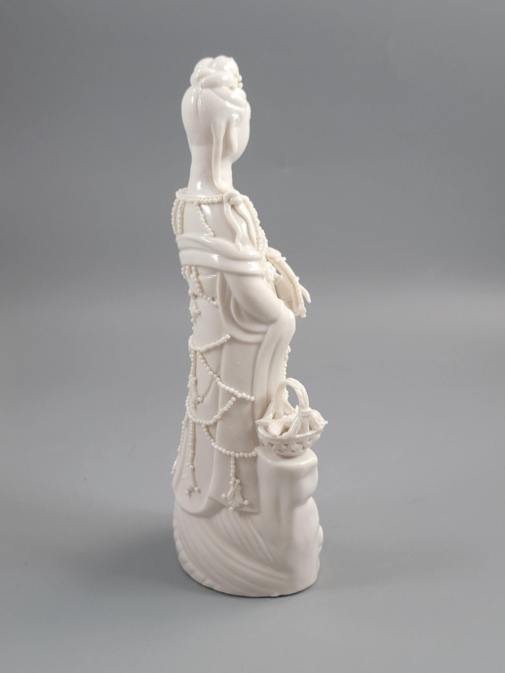 Dehua Blanc de Chine Guanyin with Fish Basket & Dragon Base, early 20th c