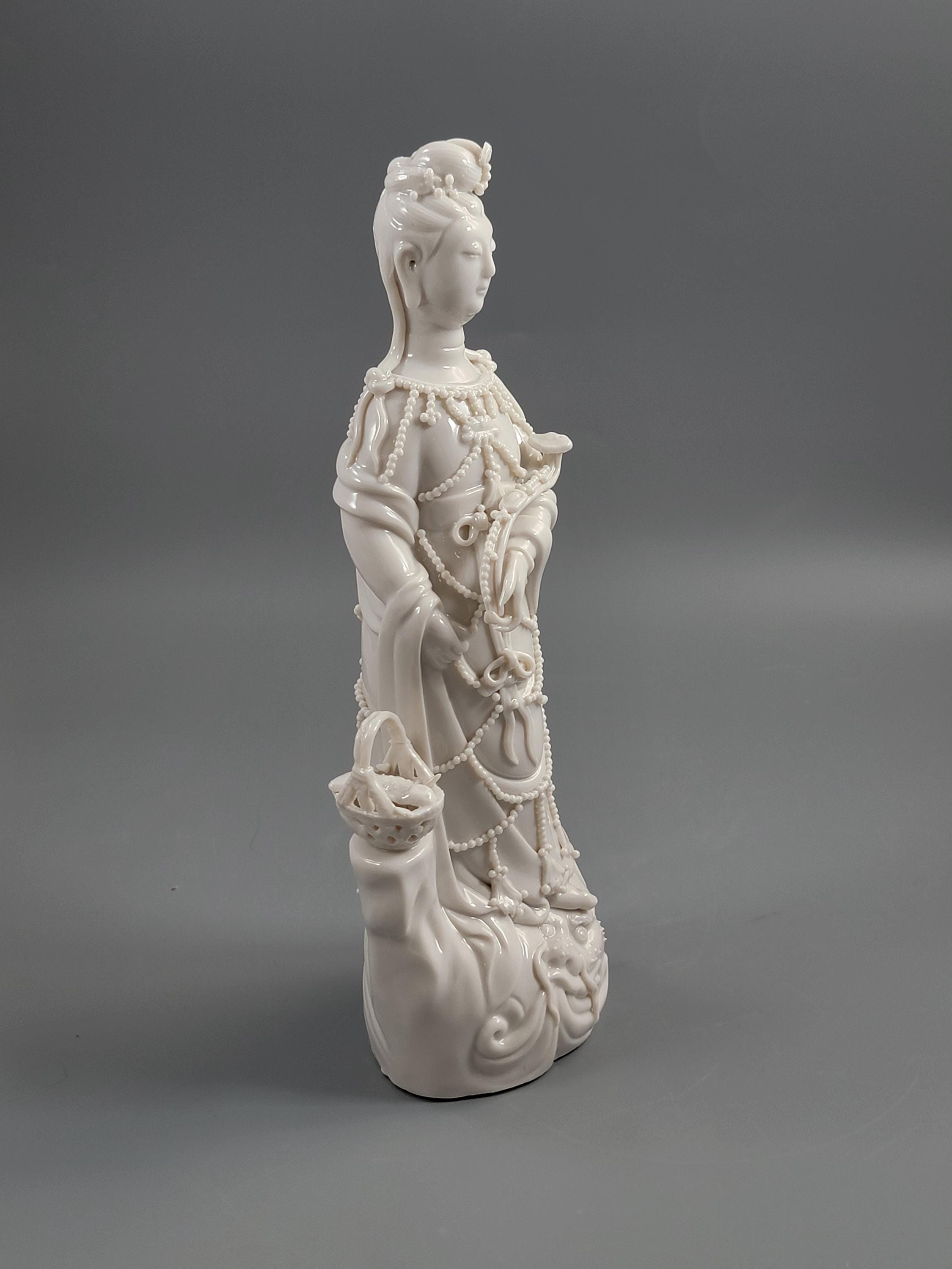 Dehua Blanc de Chine Guanyin with Fish Basket & Dragon Base, early 20th c
