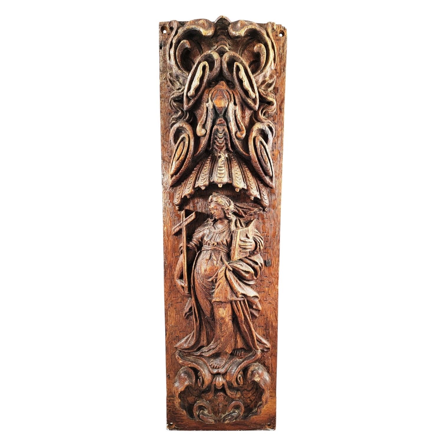 A Fine Flemish or German High Baroque Carved Oak Panel, Allegory of Faith, Late 17th Century