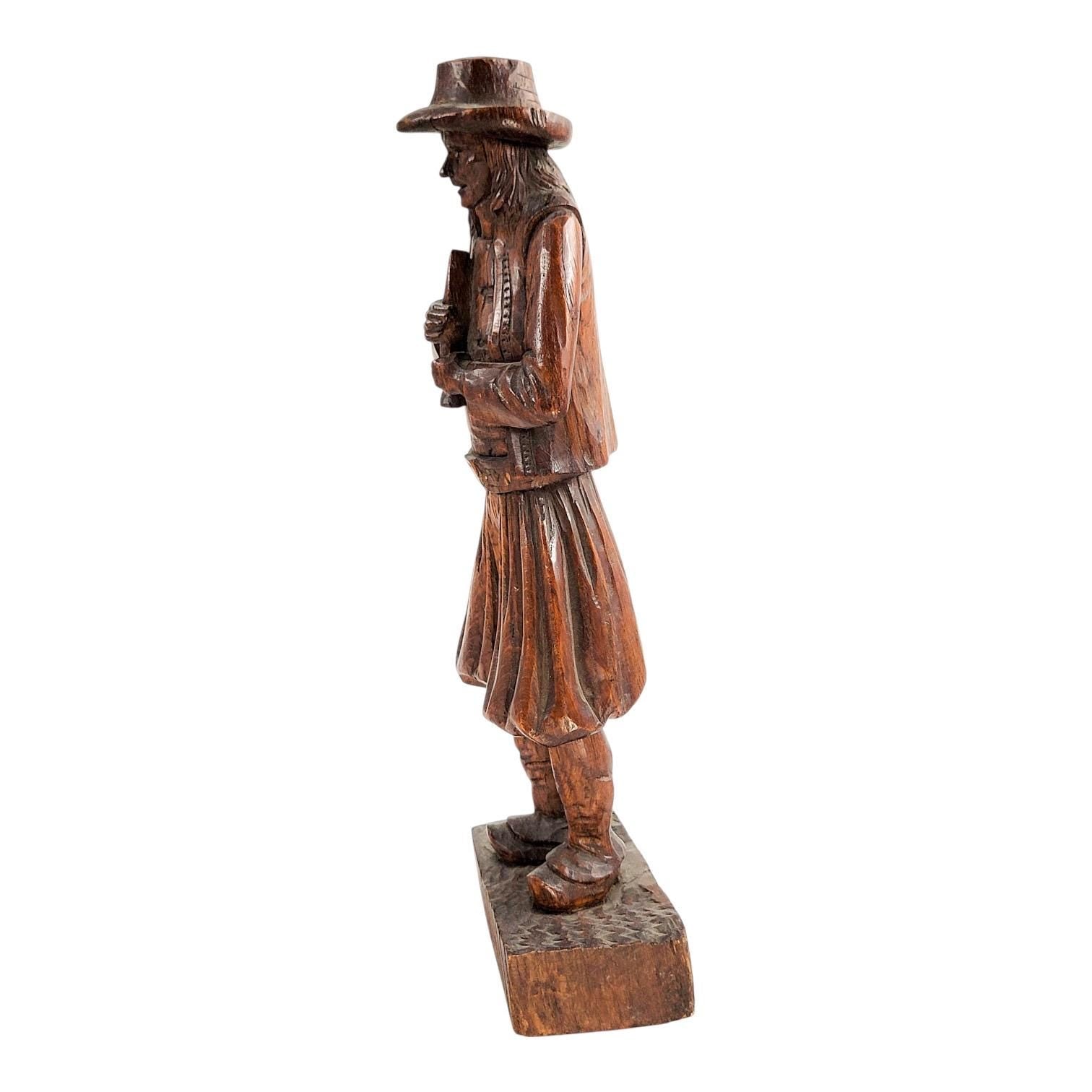Antique Black Forest oak Pied Piper statue, 19th century German hand-carved folklore figure, detailed wood sculpture home decor
