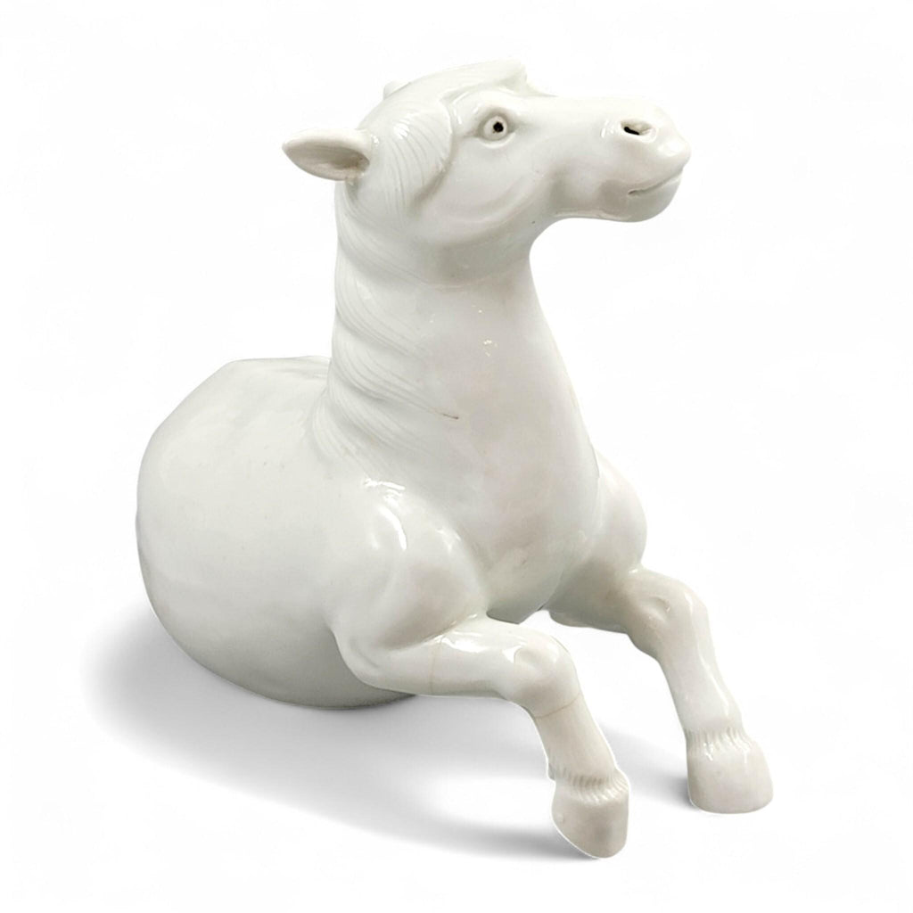 Hirado porcelain recumbent horse figurine, Mikawachi kilns Japanese white glazed sculpture, late Edo to Meiji period
