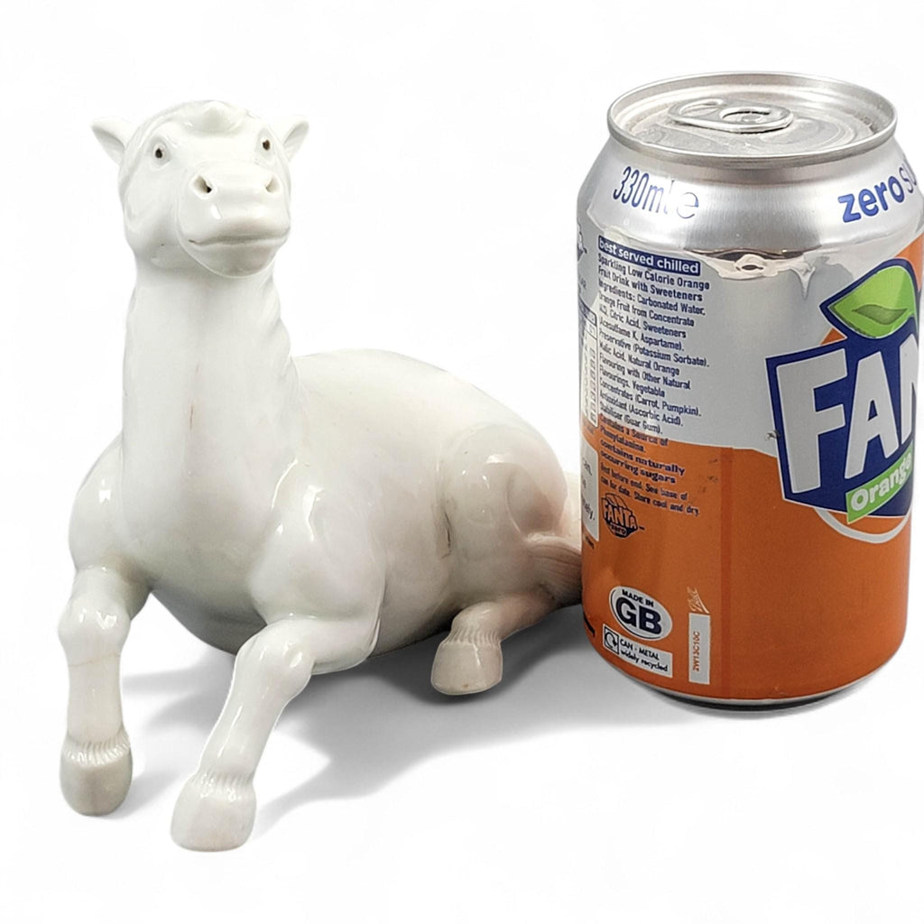 Hirado porcelain recumbent horse figurine, Mikawachi kilns Japanese white glazed sculpture, late Edo to Meiji period