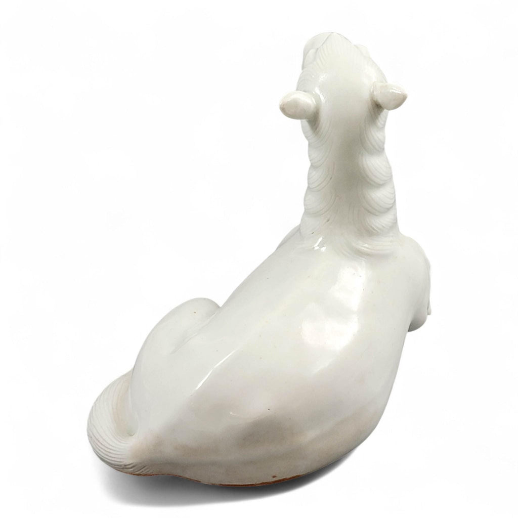 Hirado porcelain recumbent horse figurine, Mikawachi kilns Japanese white glazed sculpture, late Edo to Meiji period
