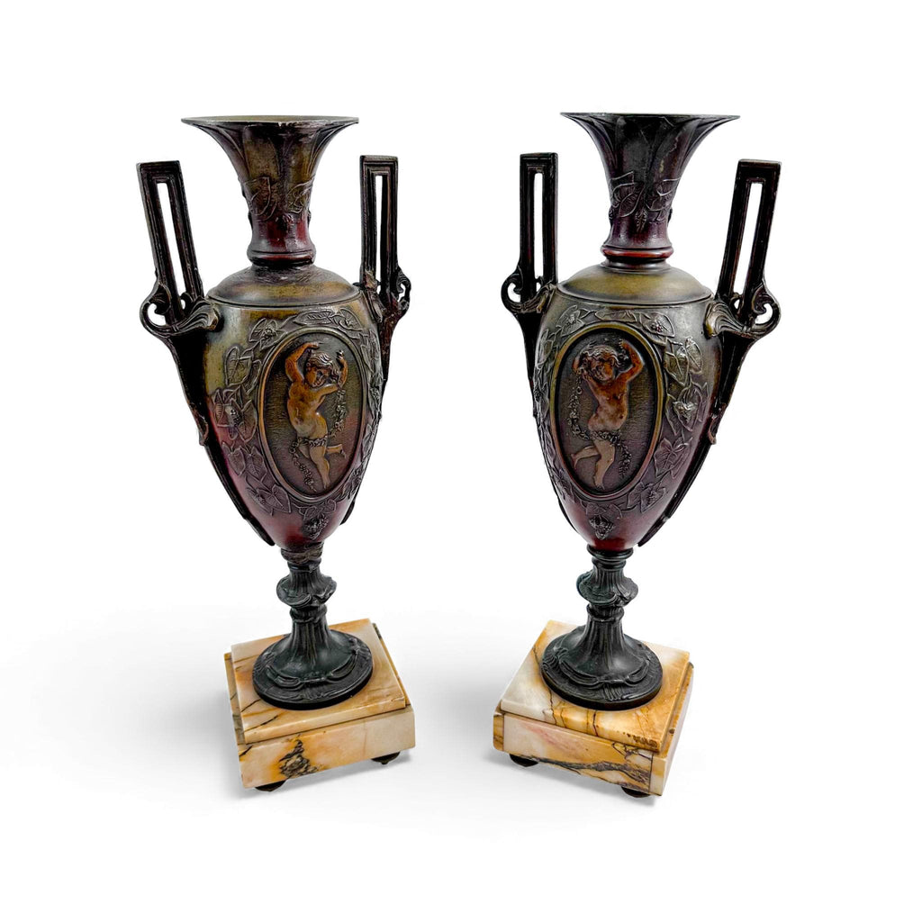 Pair of antique French Amphora vases, spelter with cherub relief, 19th century