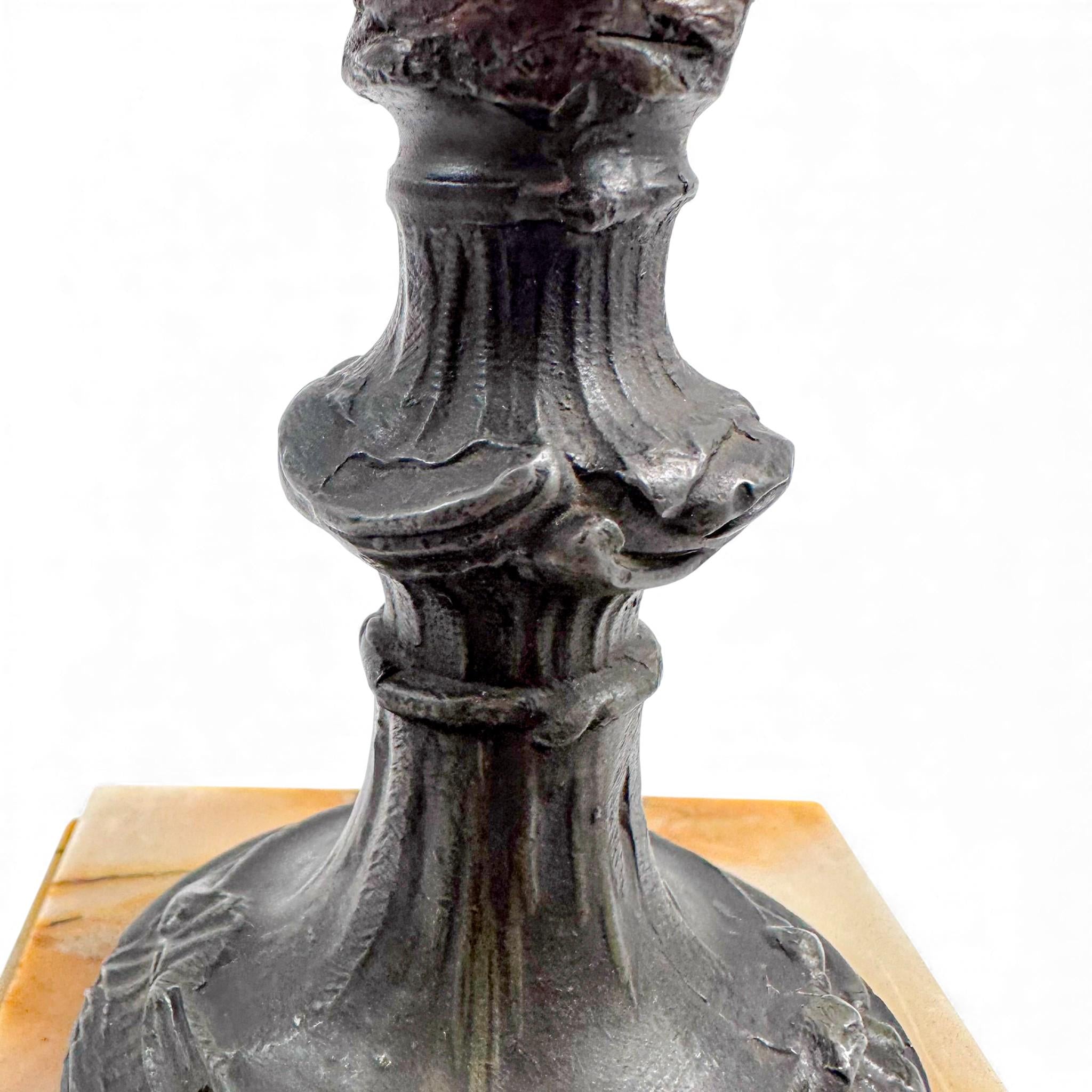 Pair of antique French Amphora vases, spelter with cherub relief, 19th century