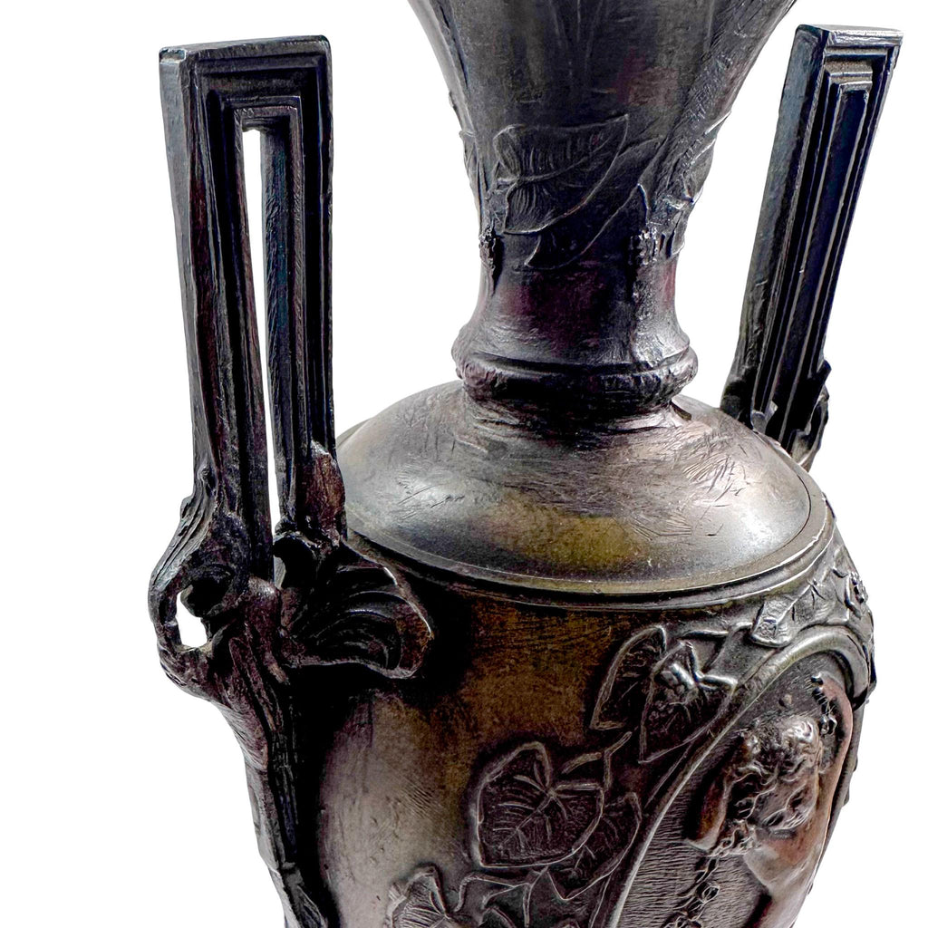Pair of antique French Amphora vases, spelter with cherub relief, 19th century