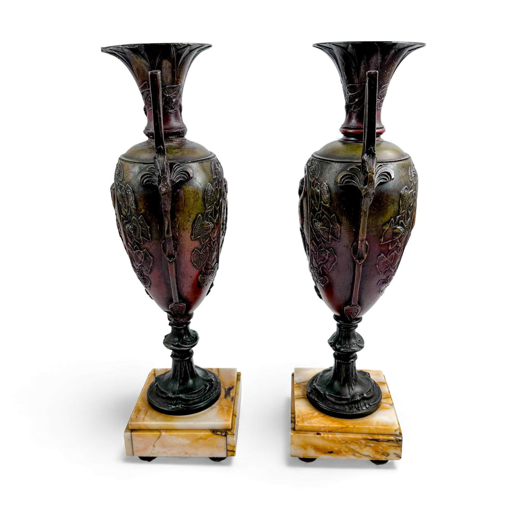 Pair of antique French Amphora vases, spelter with cherub relief, 19th century