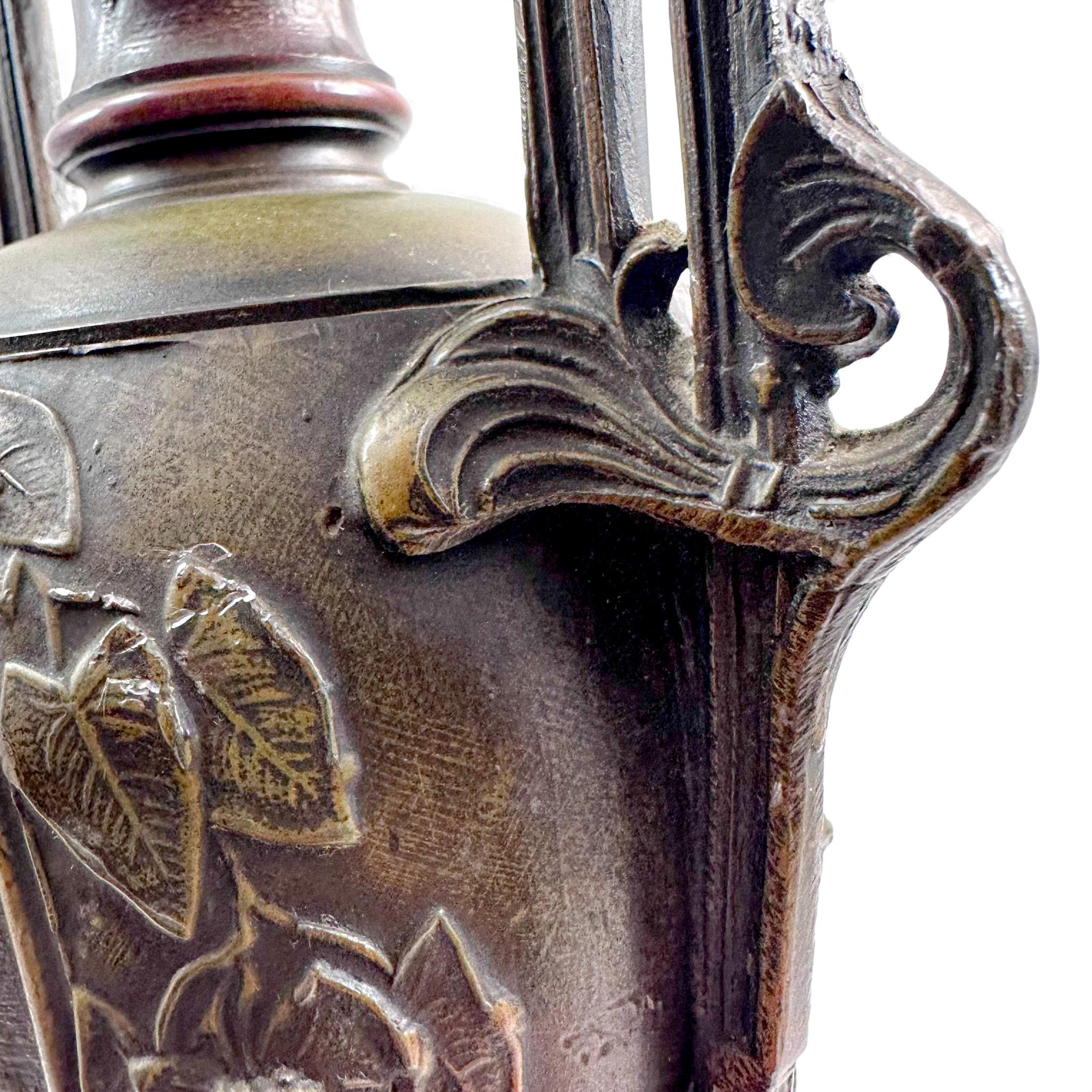 Pair of antique French Amphora vases, spelter with cherub relief, 19th century