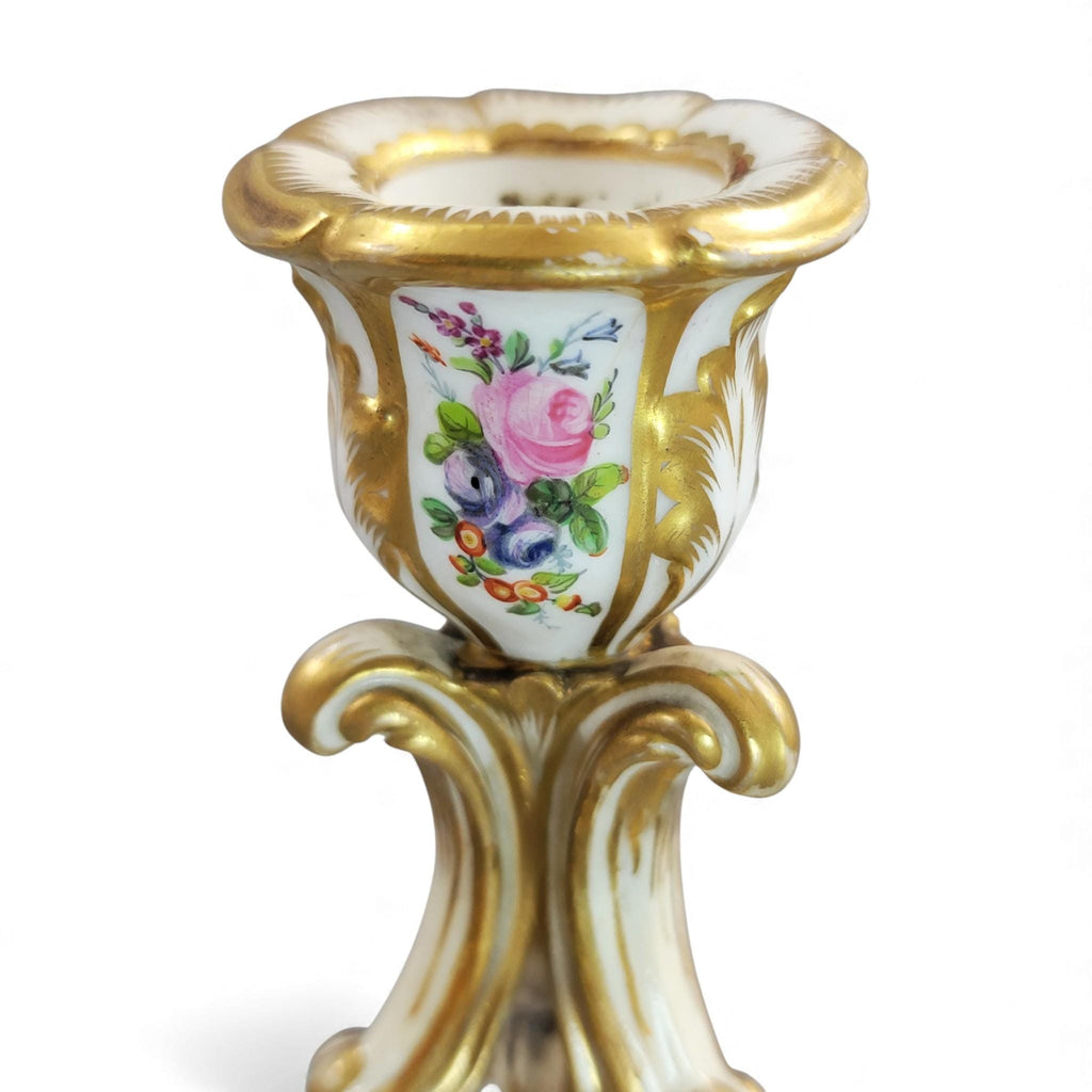 Pair of Derby rococo porcelain candlesticks c.1825–1830, hand-painted floral cups