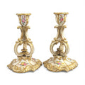 Pair of Derby rococo porcelain candlesticks c.1825–1830, hand-painted floral cups